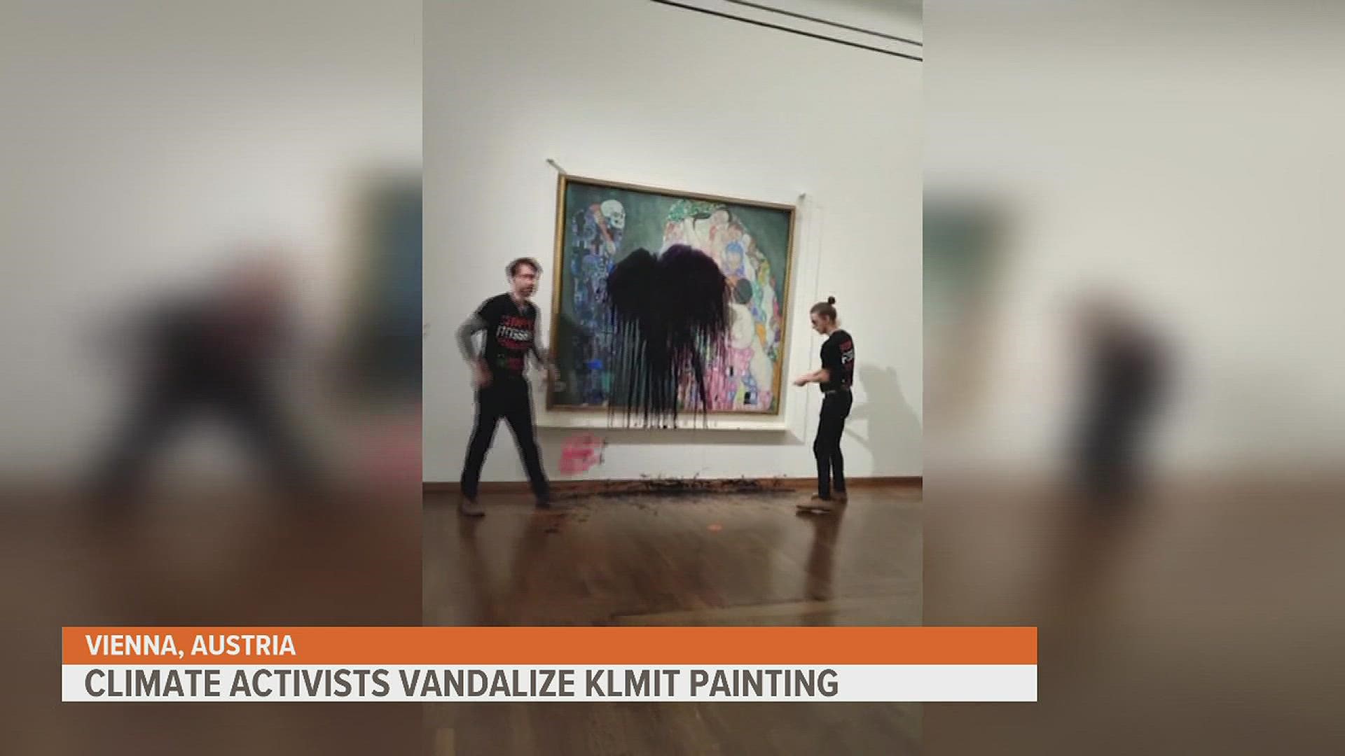 One activist threw liquid on the painting called "Death and Life." Another activist glued his hand to the glass protecting the art work. The art was not damaged.