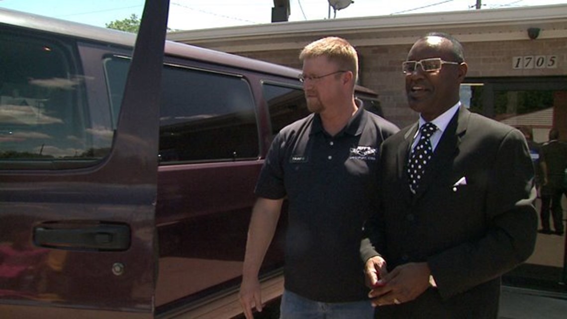 Davenport car dealership donates 15 passenger van to community church