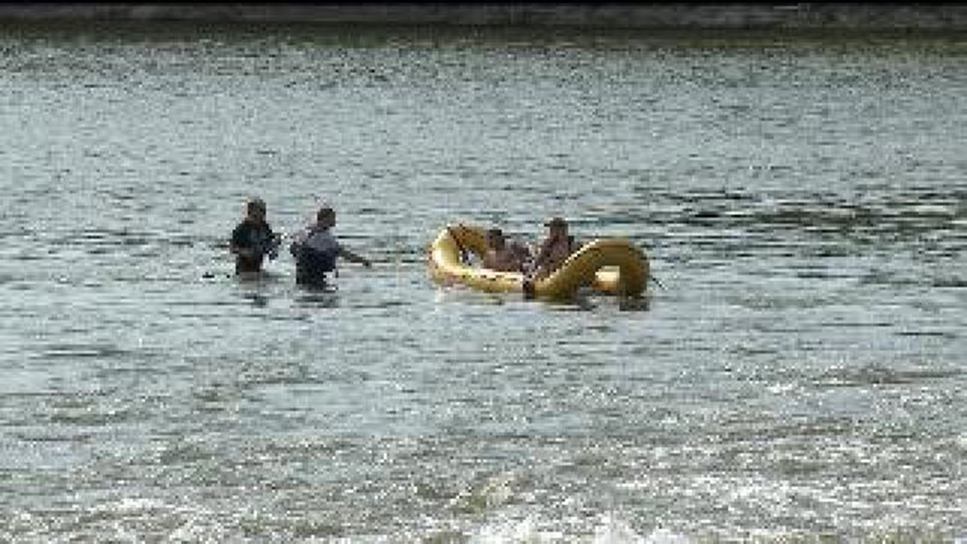Men rescued from Rock River