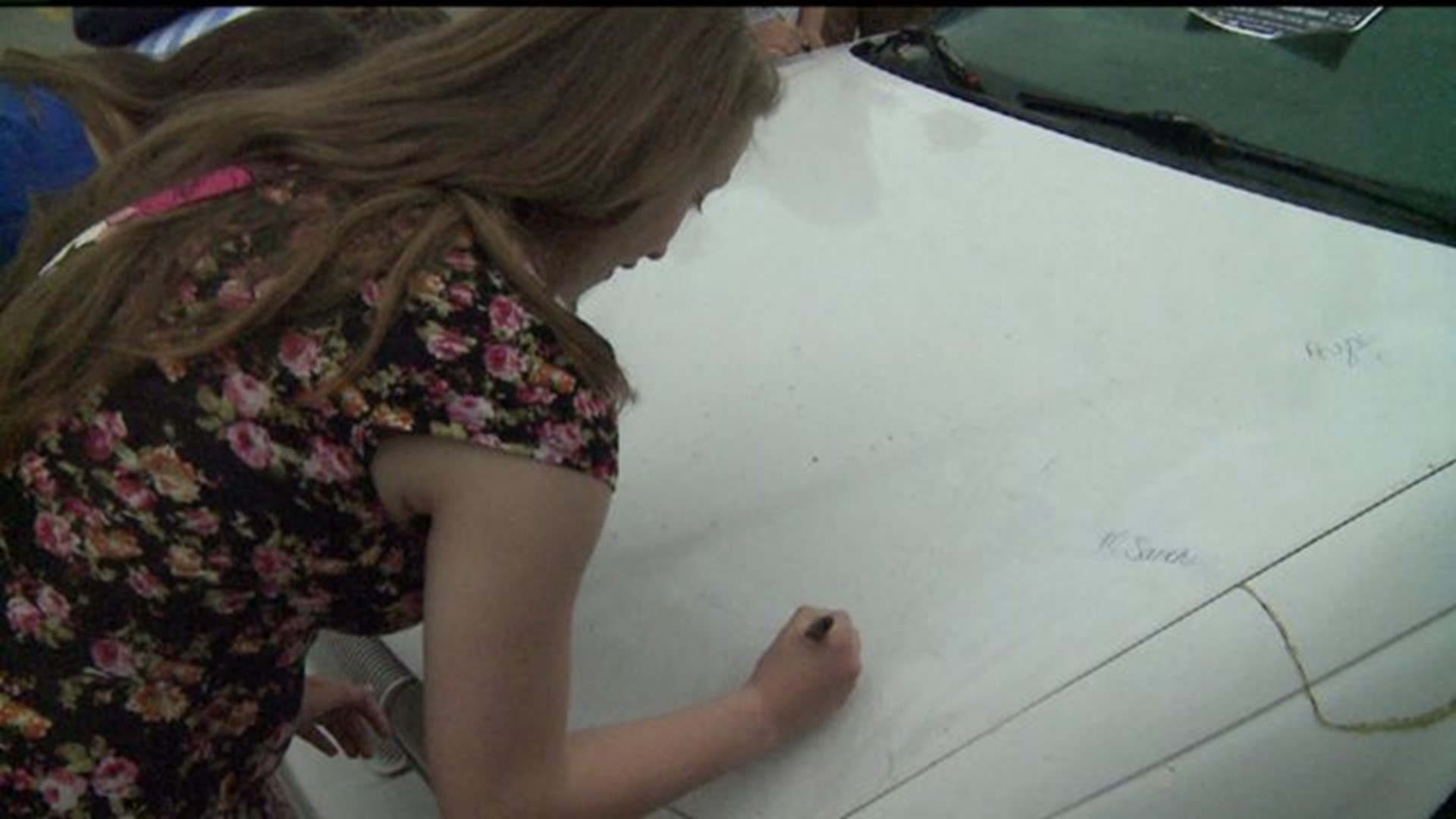Moline students sign car promising to not text and drive