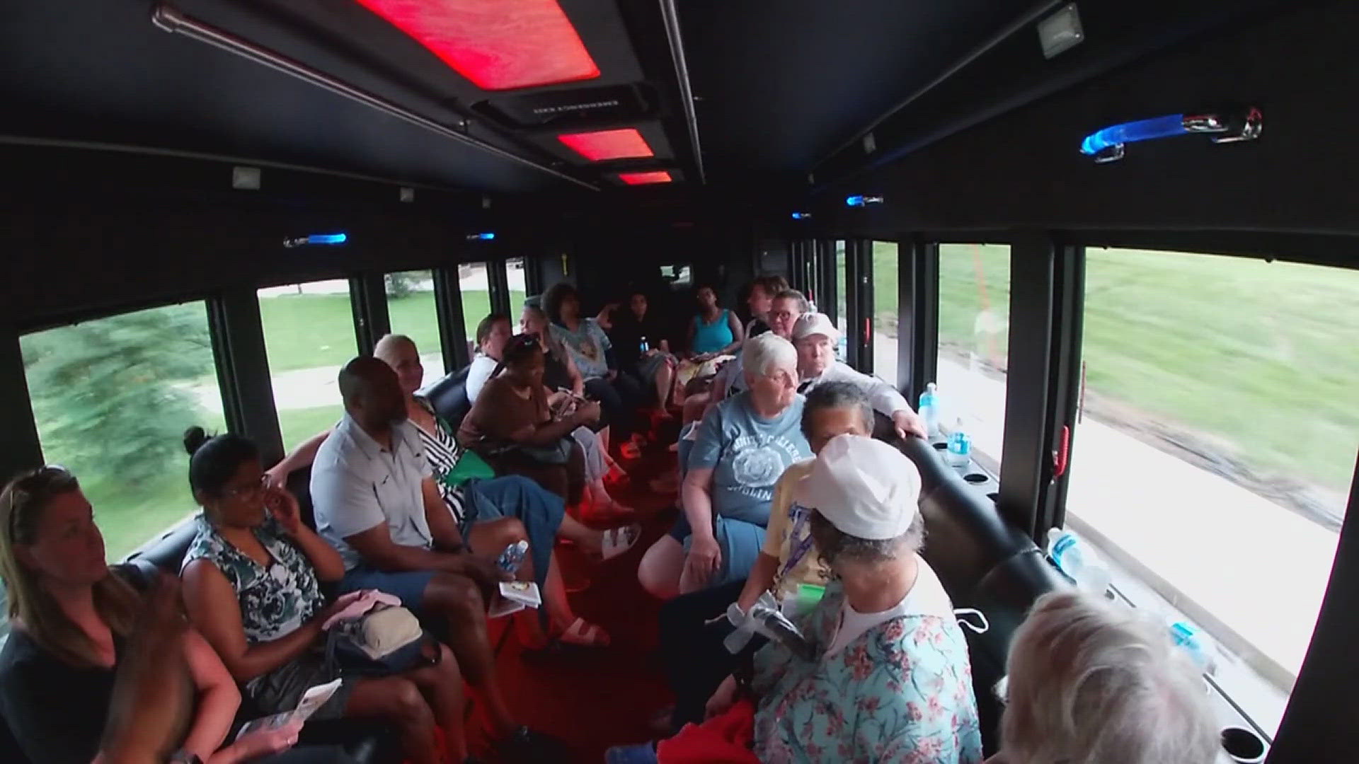 The tour began at the Putnam Museum and included stops at St. Ambrose's Christ is King chapel and Charles and Ann Toney's house.