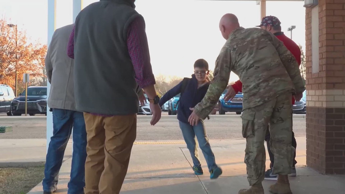 'Dads at the Door' greets Mississippi students with high-fives to start the school day