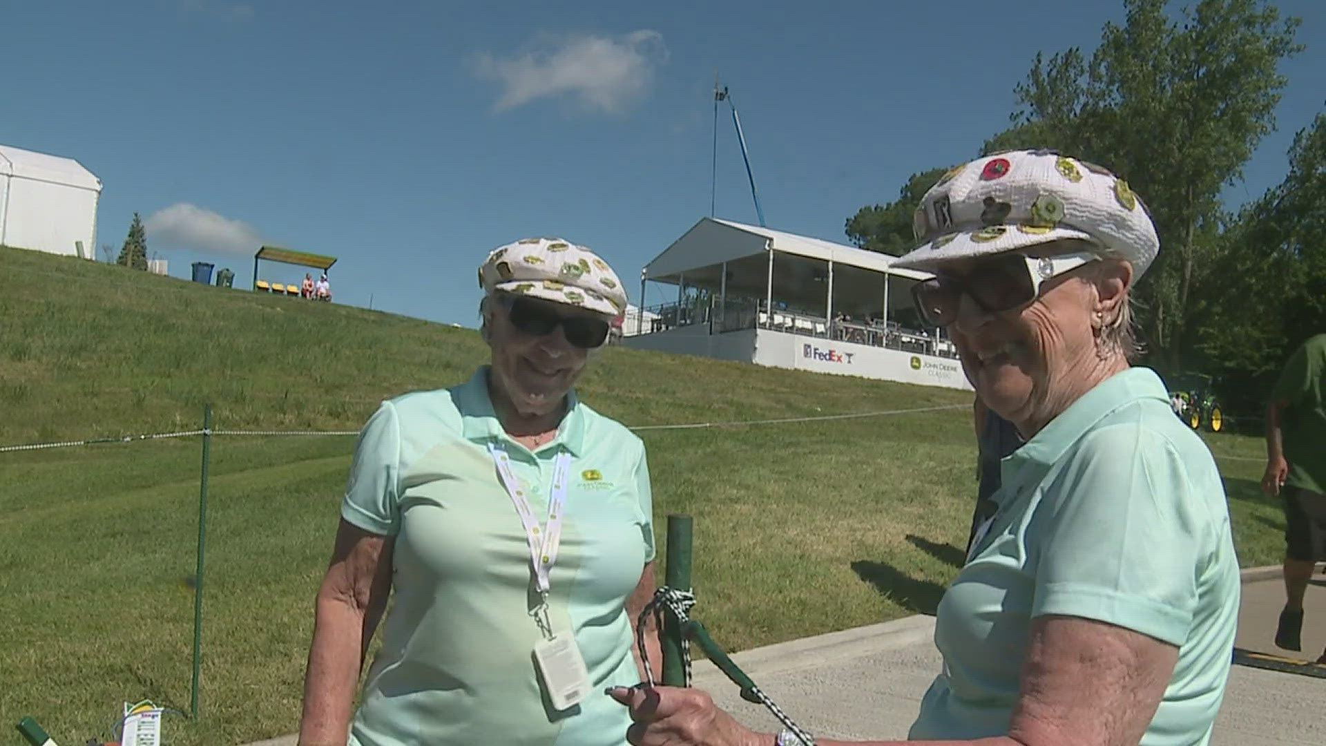 Barbie has been volunteering at the Classic for 20 years. Her good friend Betty — who dons a matching hat — has been volunteering for 18.