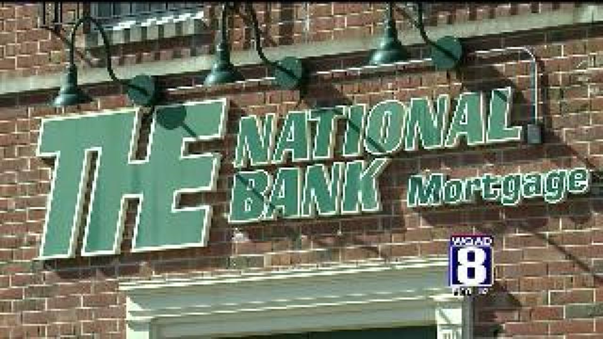 Parent of THE National Bank sold