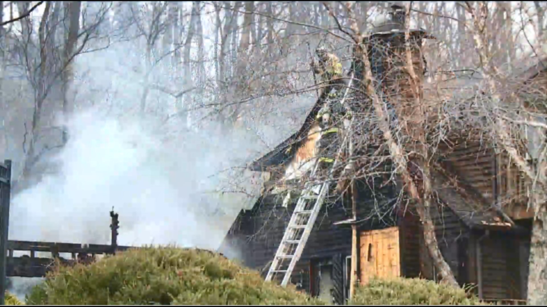 Le Claire residence fire levels garage, damages car