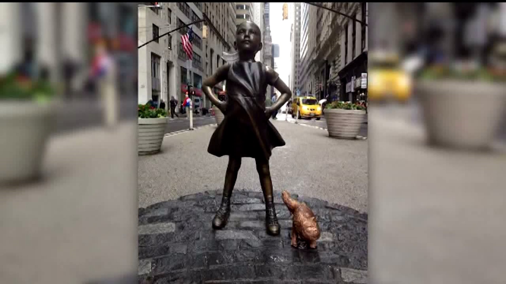 Artist "adds" to Fearless Girl statue on Wall Street