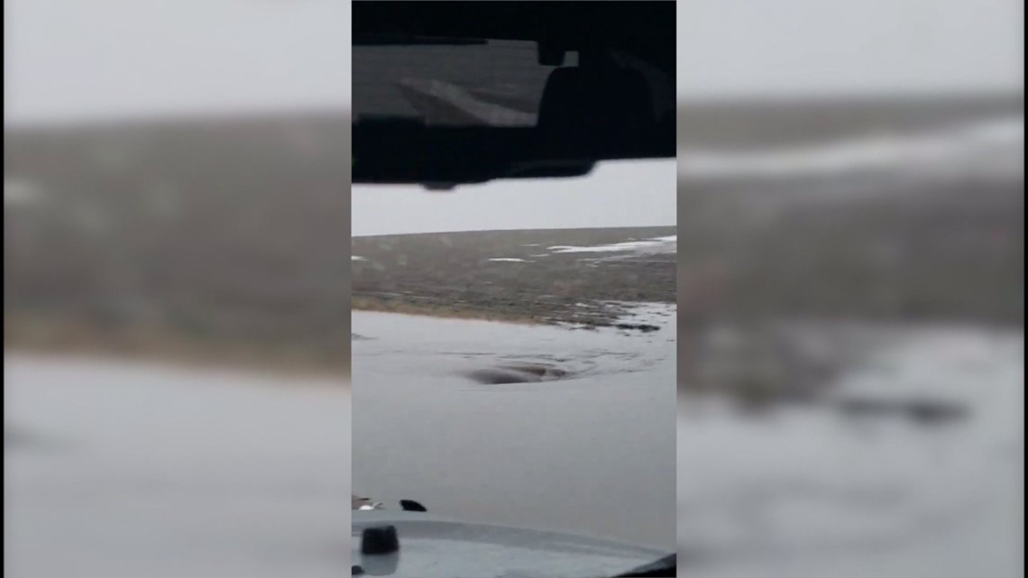 Watch Flood waters look like whirlpool flowing down drain near