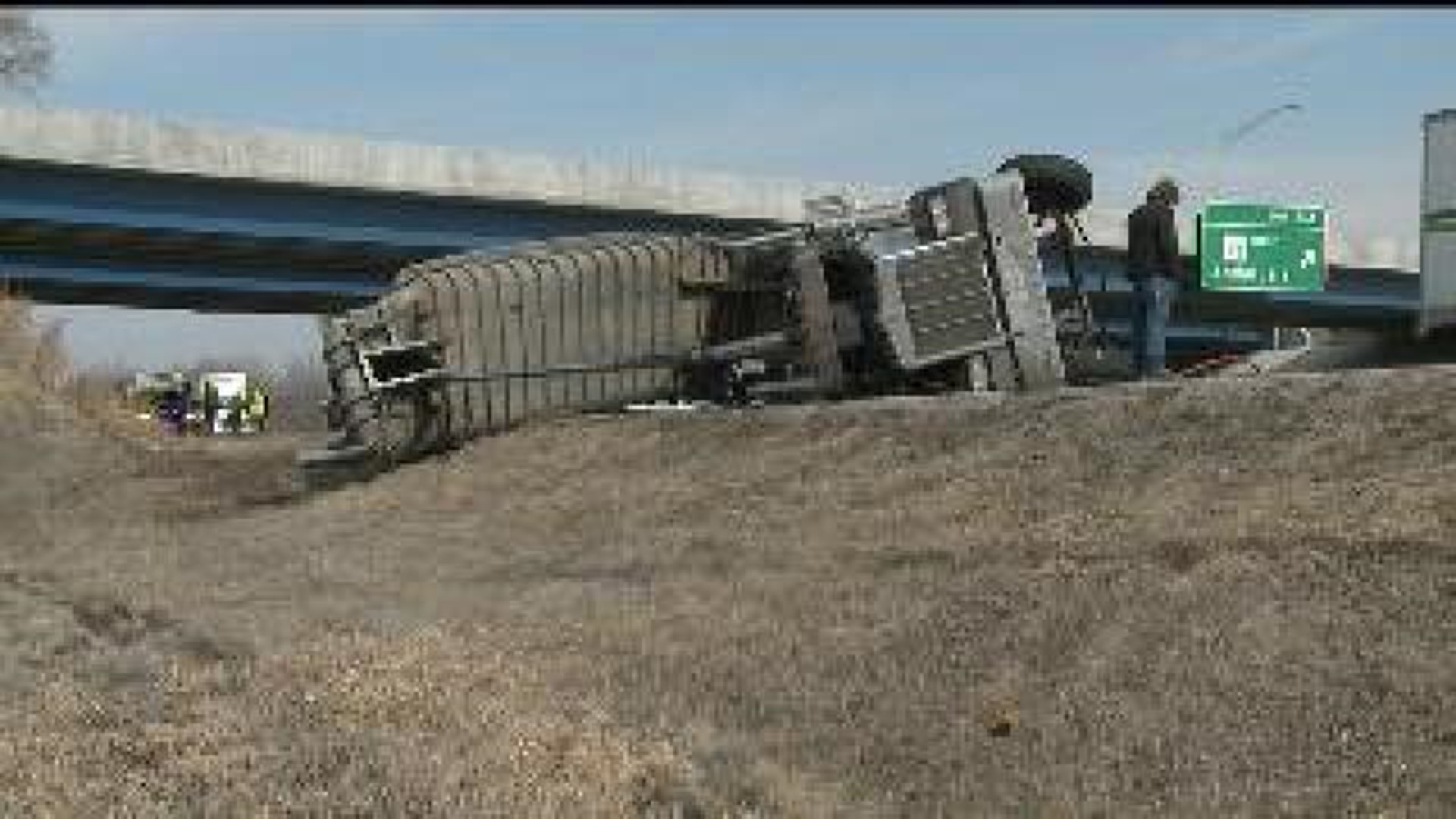 Semi truck rams overhead sign and overpass in Milan