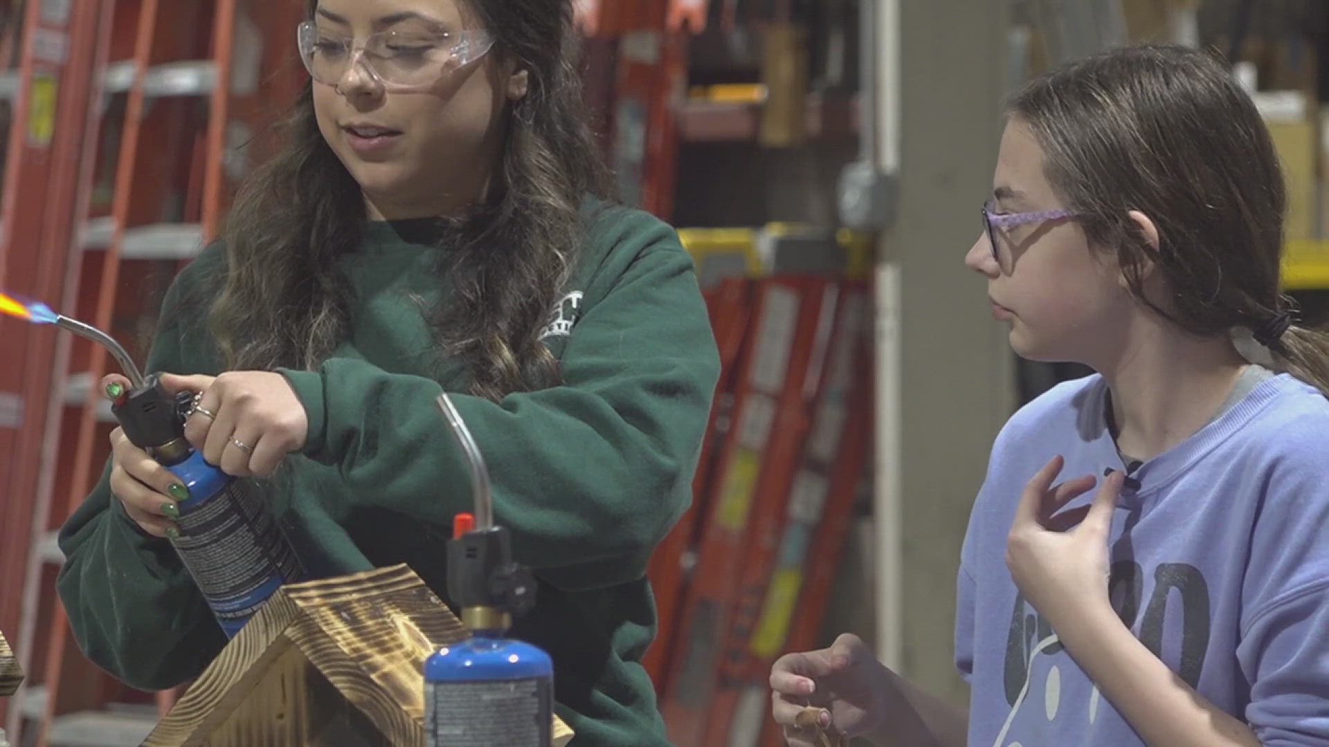 wqad.com - Jonas Evans - Girl Scouts learn construction skills at Bush Construction workshop