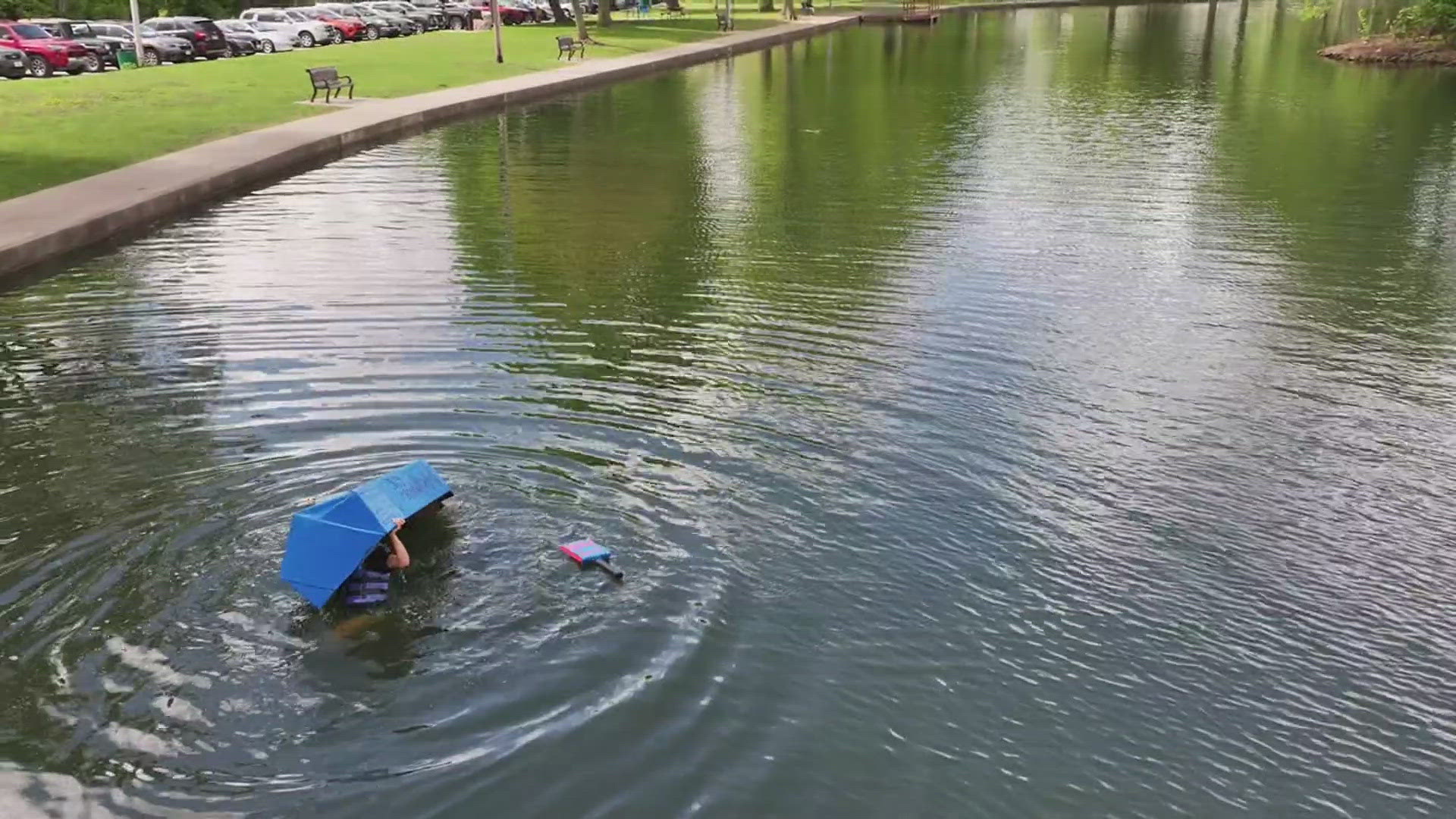 QC high school students put their skills to the test at Middle Park Lagoon to see who could build the best cardboard boat.