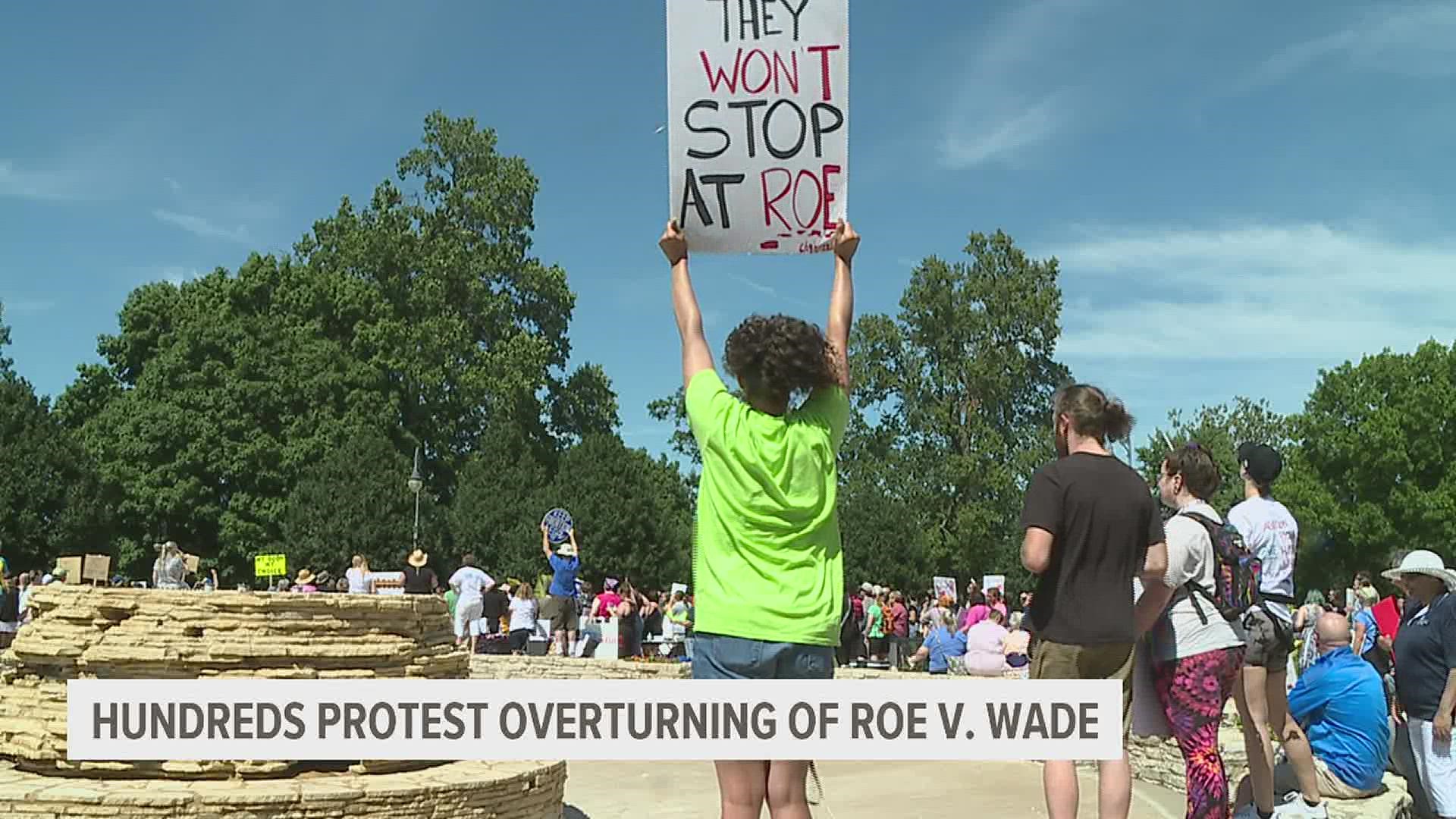 Protestors met in Vander Veer Park in Davenport and then marched down the streets carrying signs and demanding change.