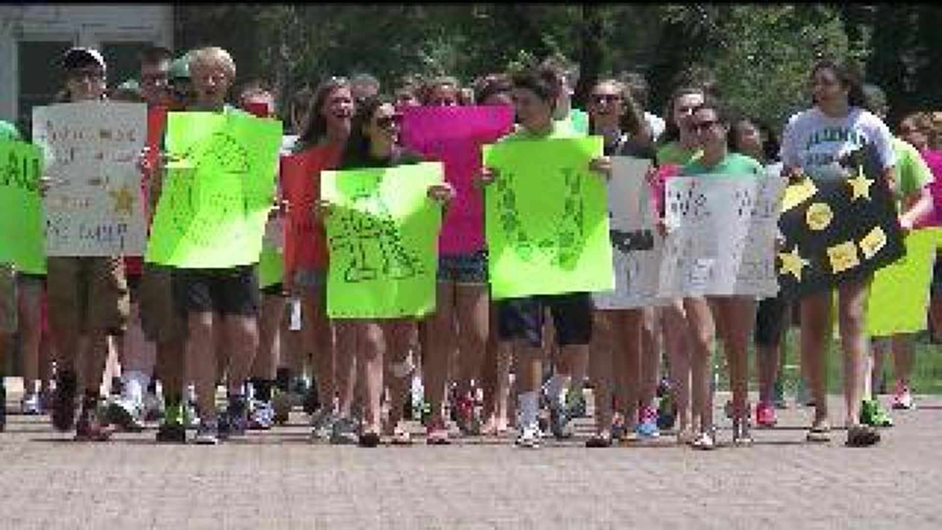 High school students rally for dismissed teacher at Diocese in Peoria