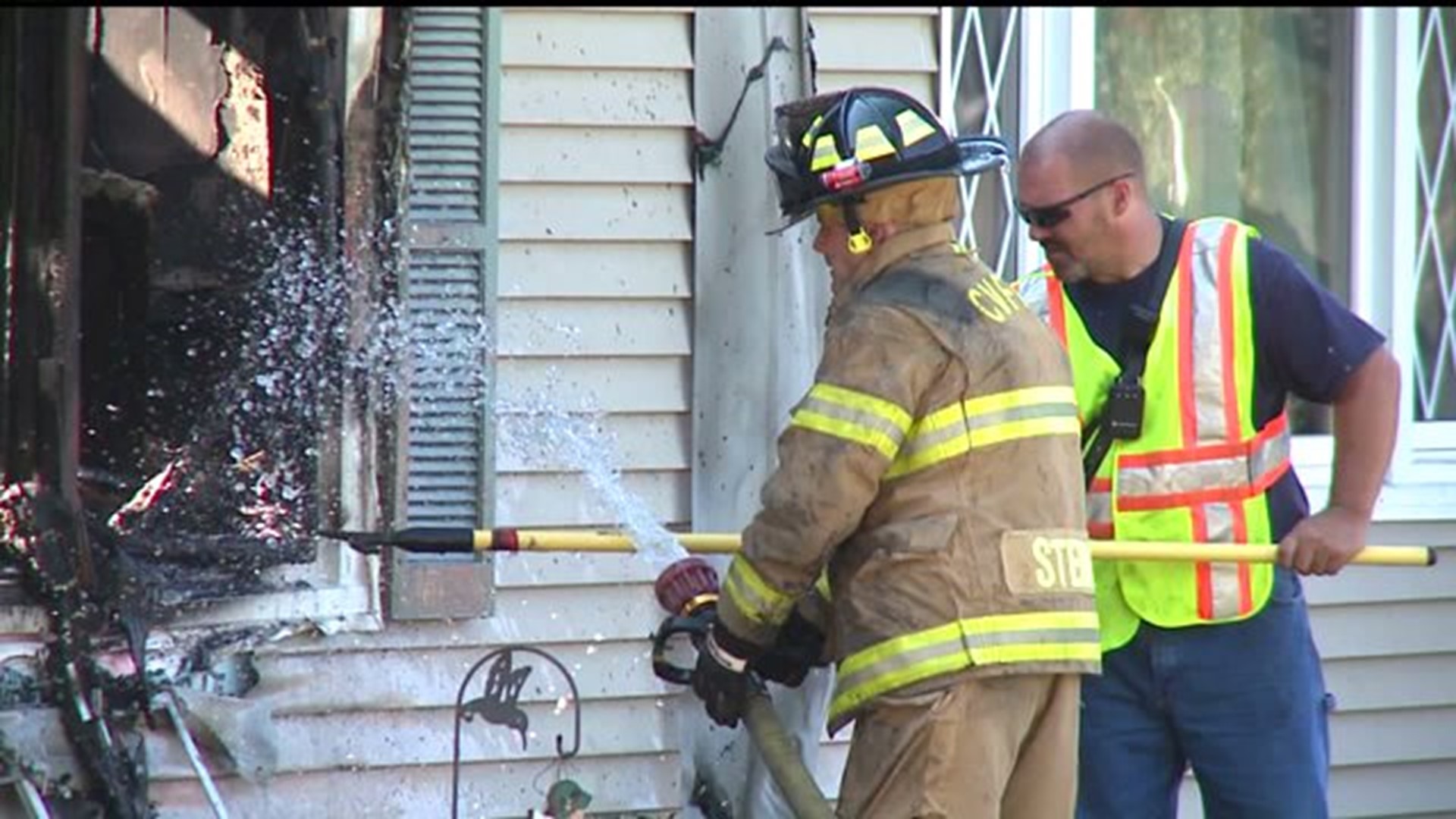 Coal Valley police officer dives through window to pull man from burning home