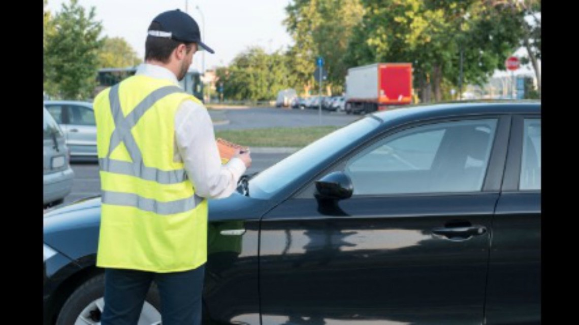 Marking tires with chalk to track how long a car has been parked