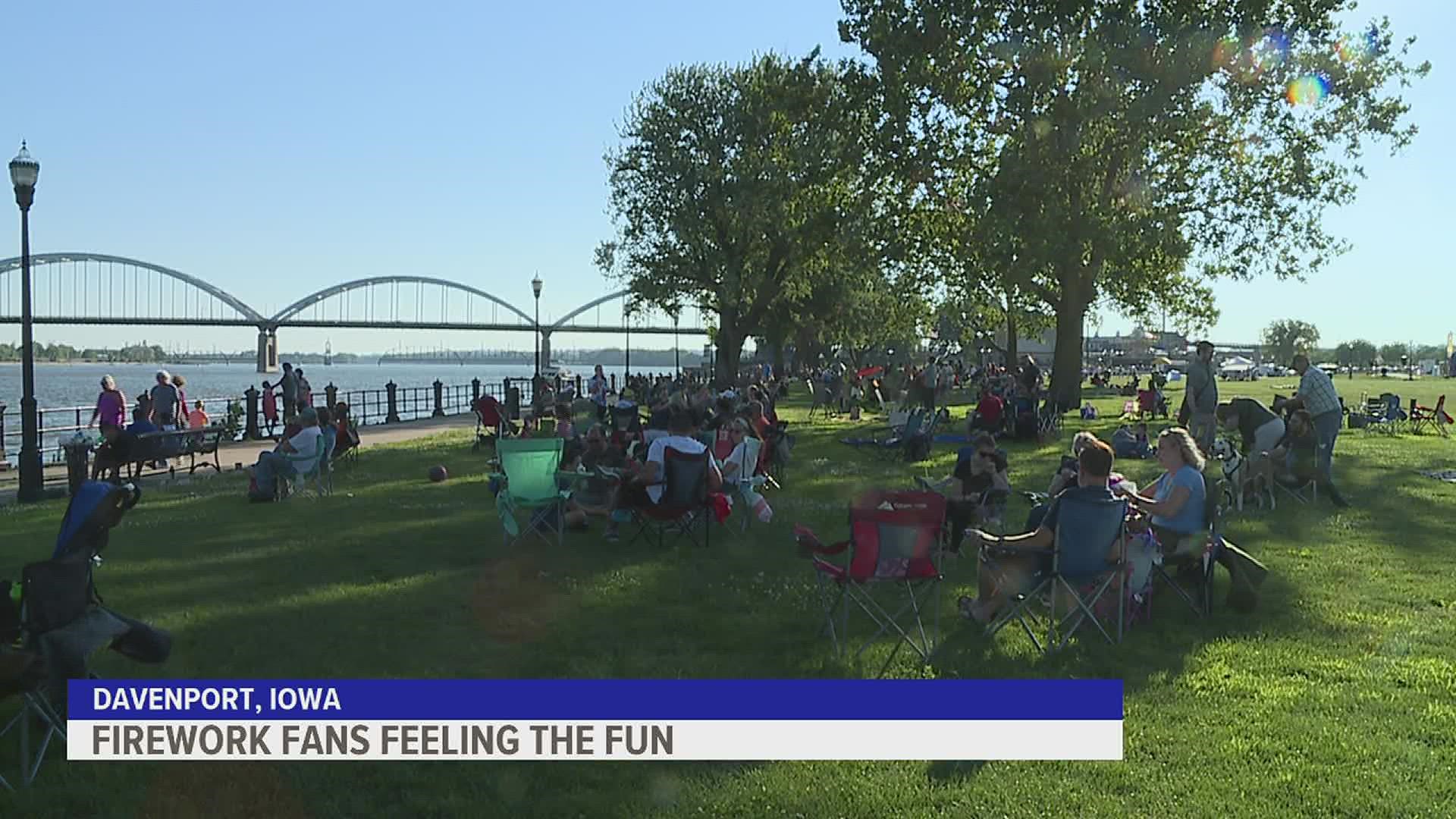 Hundreds of people staked out the viewing areas early and god good spots along the river just before the Red White and Boom fireworks took off at dusk on Sunday.