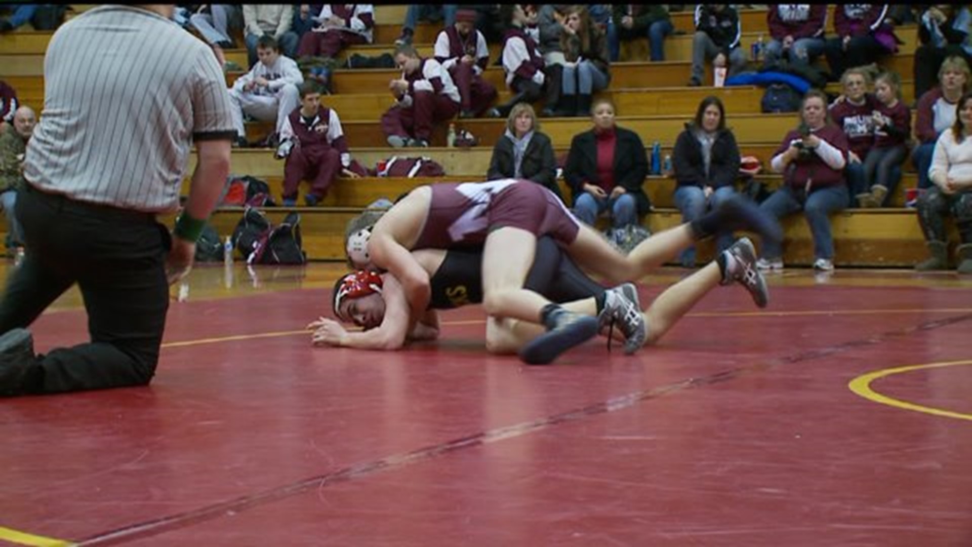 Moline pins down win in conference opener