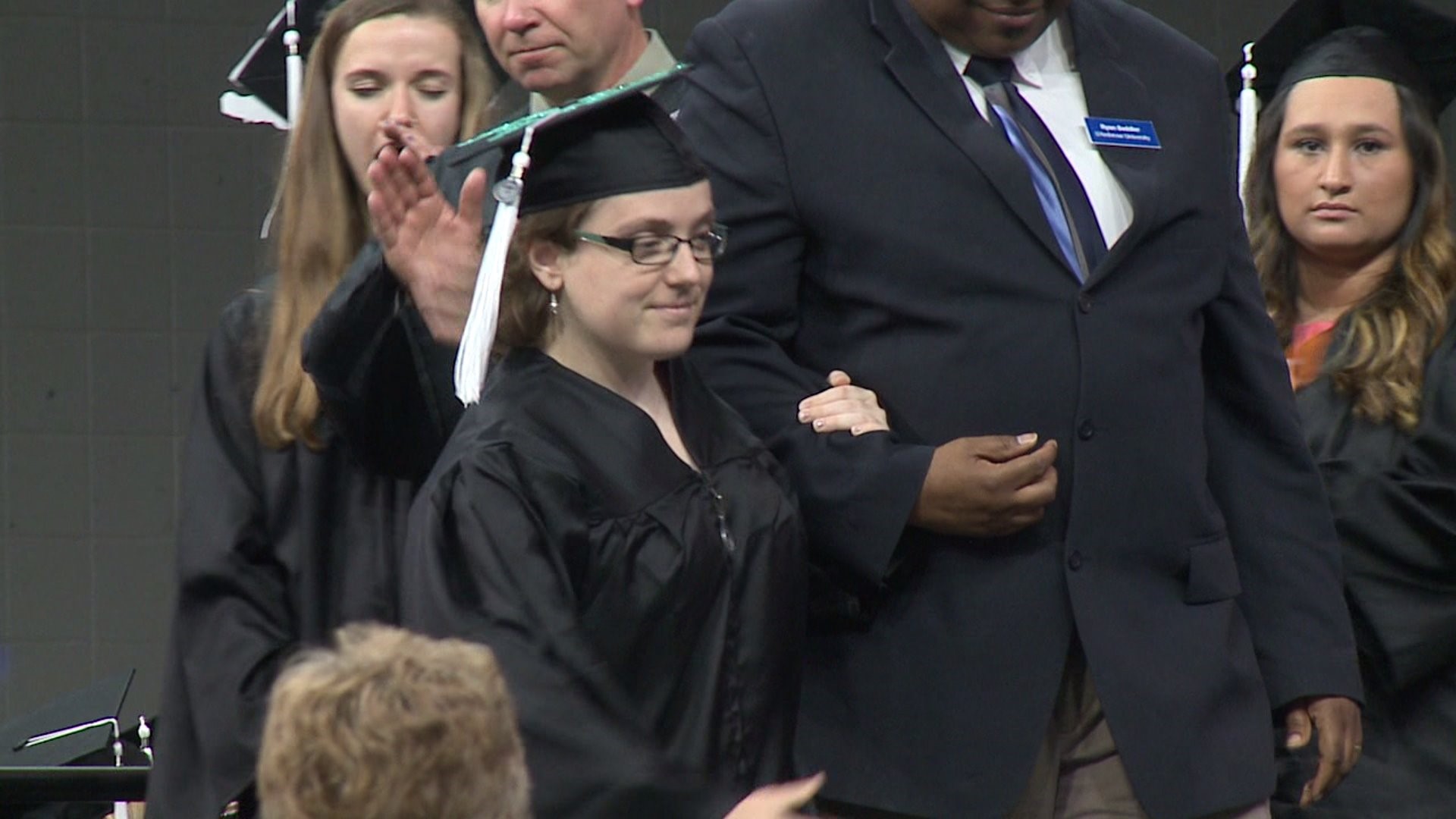 St. Ambrose student walks across graduation stage without her