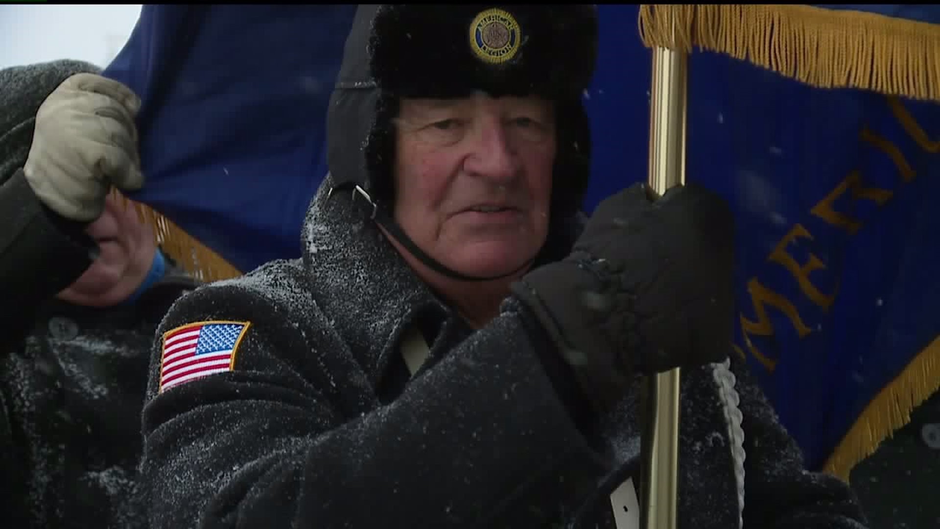 QC braves Veterans Day snow for annual parade