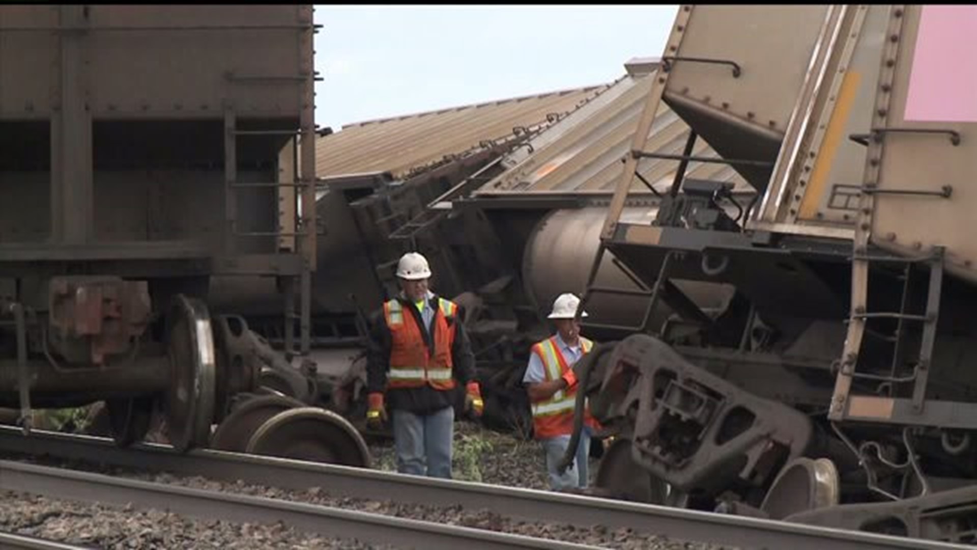Dozens of train cars knocked over by winds