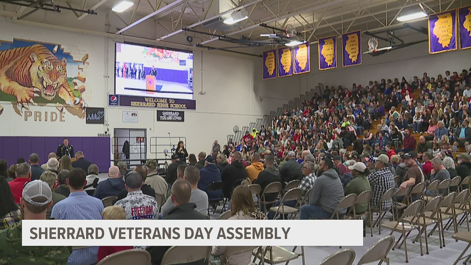 The assembly included elementary students singing America The Beautiful and a flag folding demonstration.