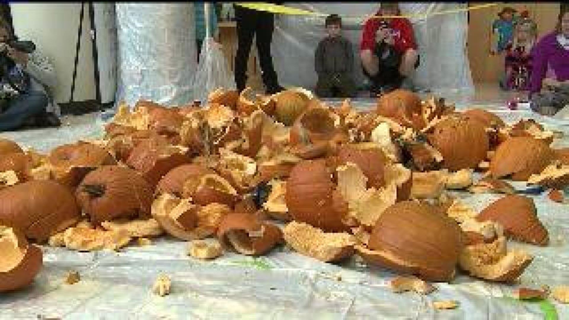 Families bring jack-o-lanterns to Pumpkin Smash