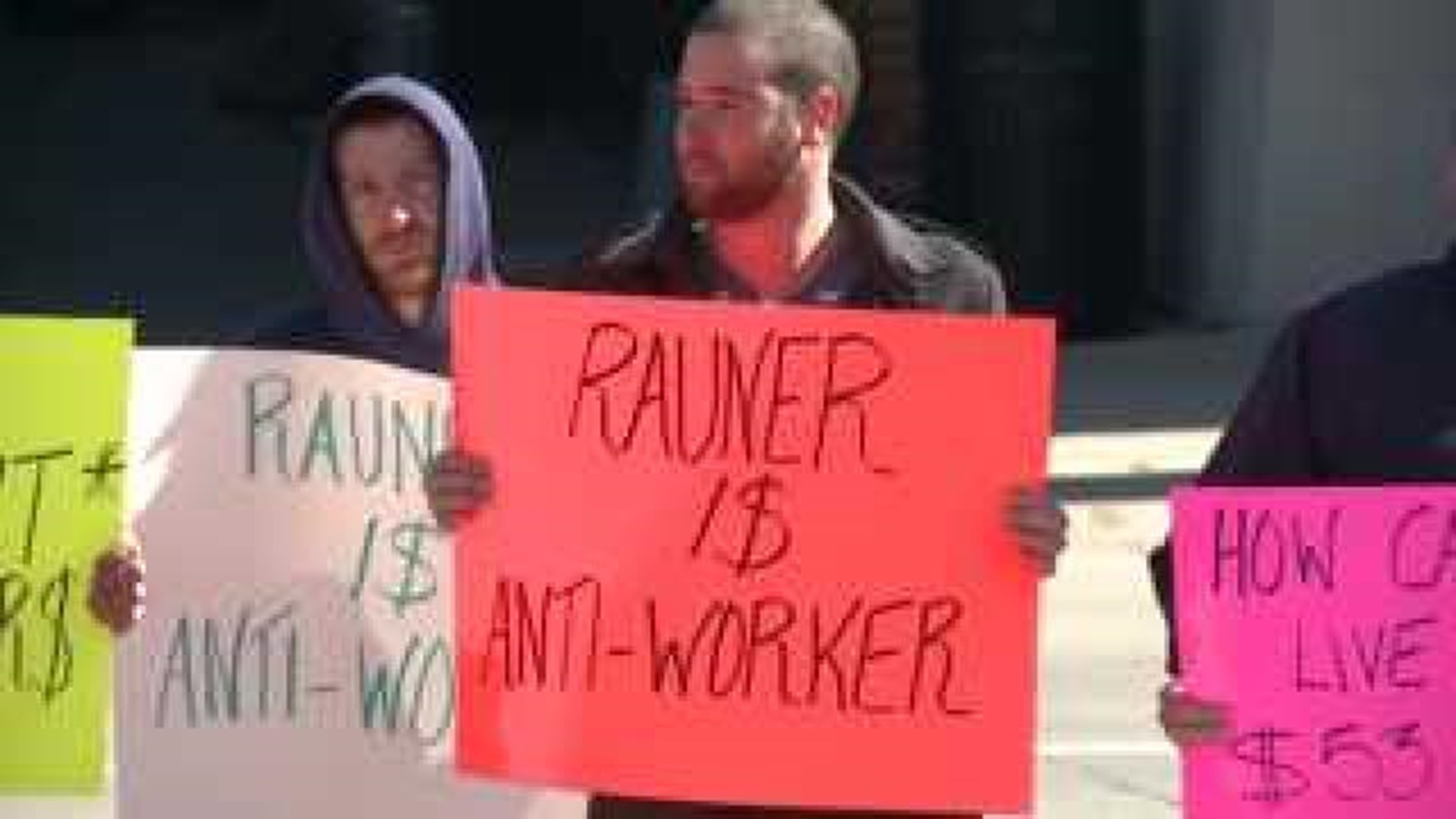 Rauner protested as he tries to get out the vote