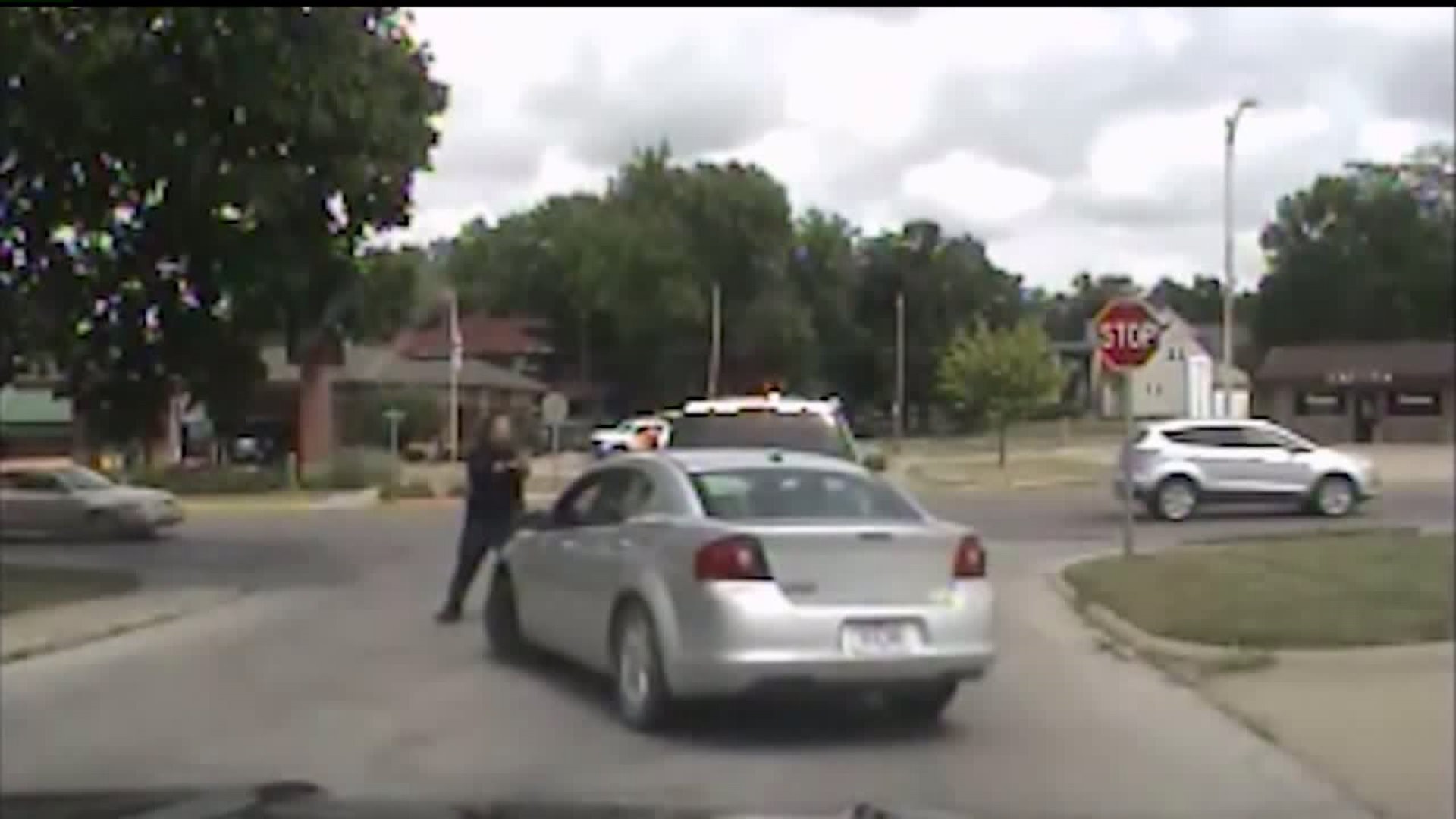 Iowa woman runs over police officer