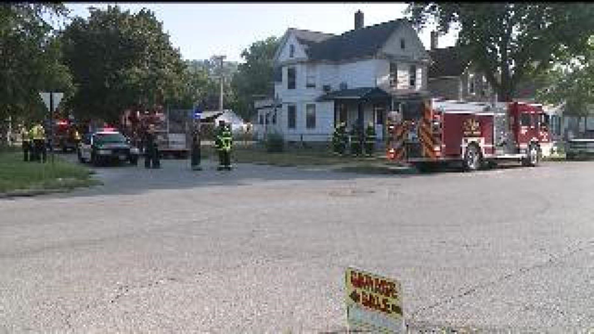 Toddler home alone, rescued from house fire