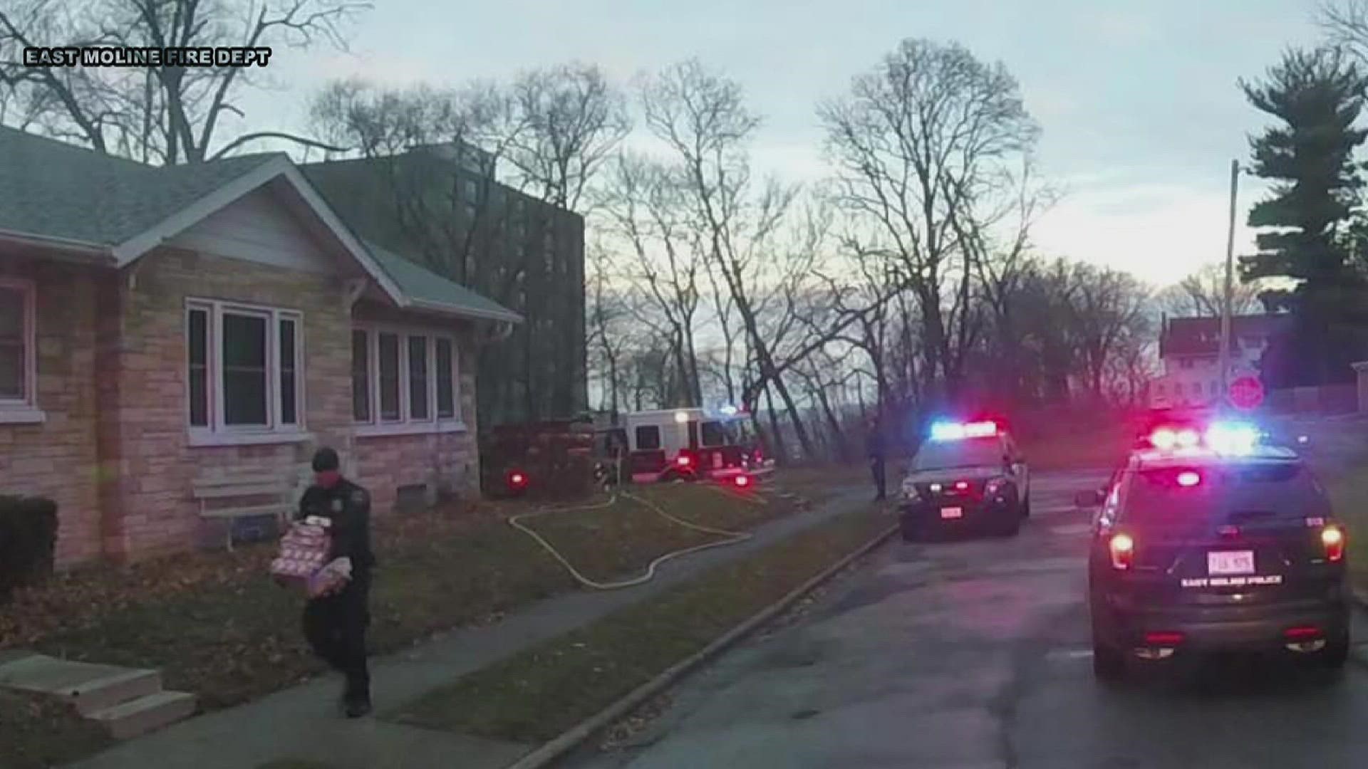 An East Moline family was okay and able to celebrate some of their Christmas Day after a police officer rescued their presents.