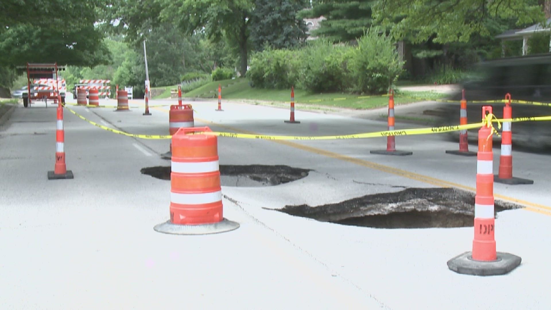 The area between Woodland and Kenwood is closed on both sides after the sinkholes started creeping across the road.