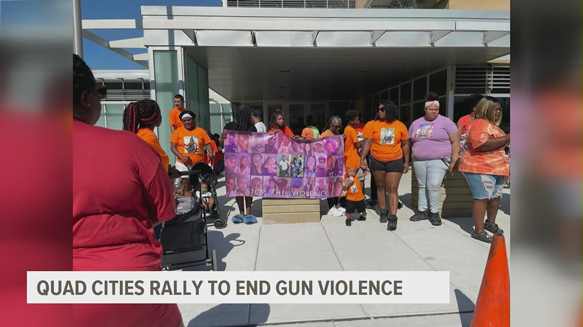 Dozens rally to end gun violence outside Davenport Police Station