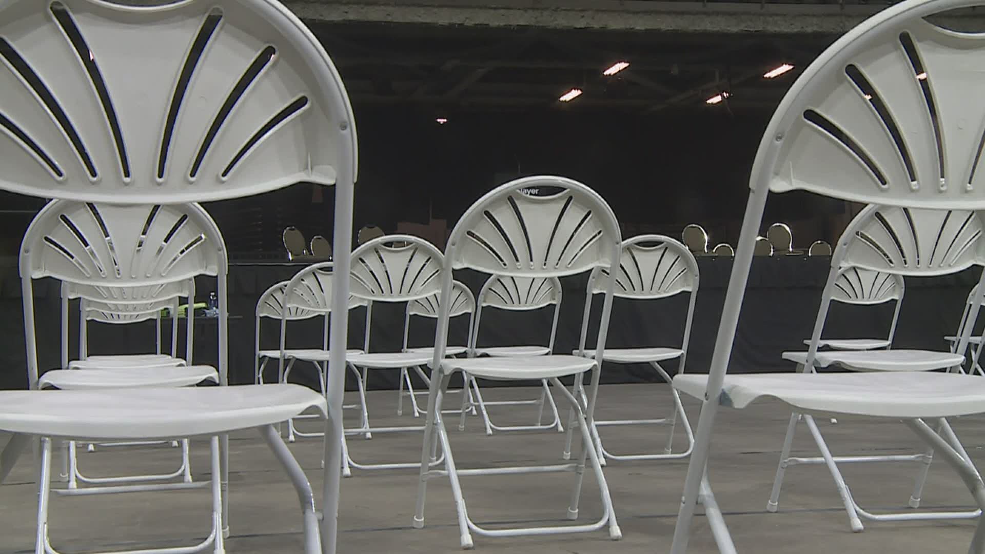 The center hosts its first graduation ceremony on the same day Illinois begins its "Bridge Phase".