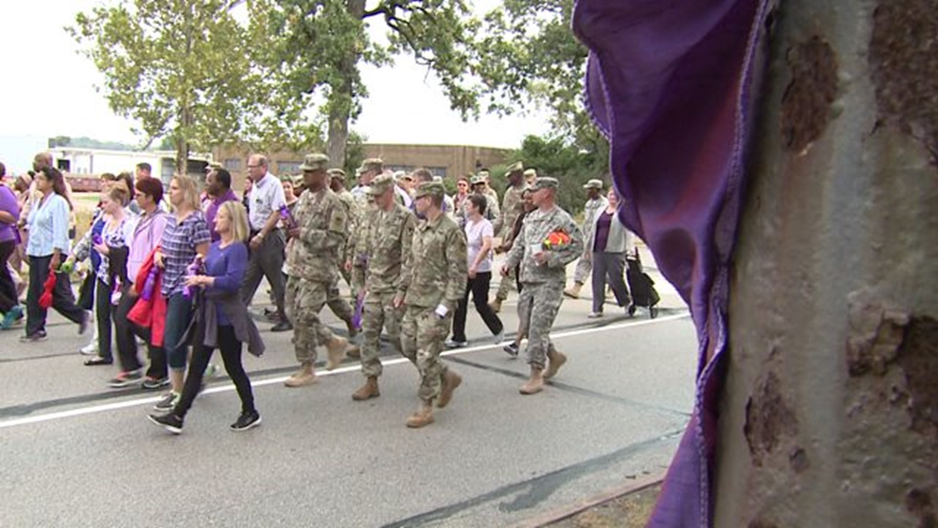 Arsenal workers march to raise domestic violence awareness