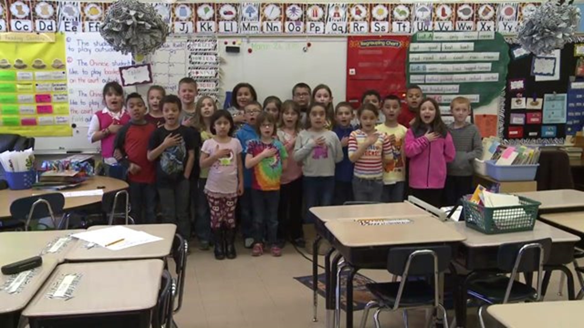Mrs. Wright`s class says the Pledge of Allegiance