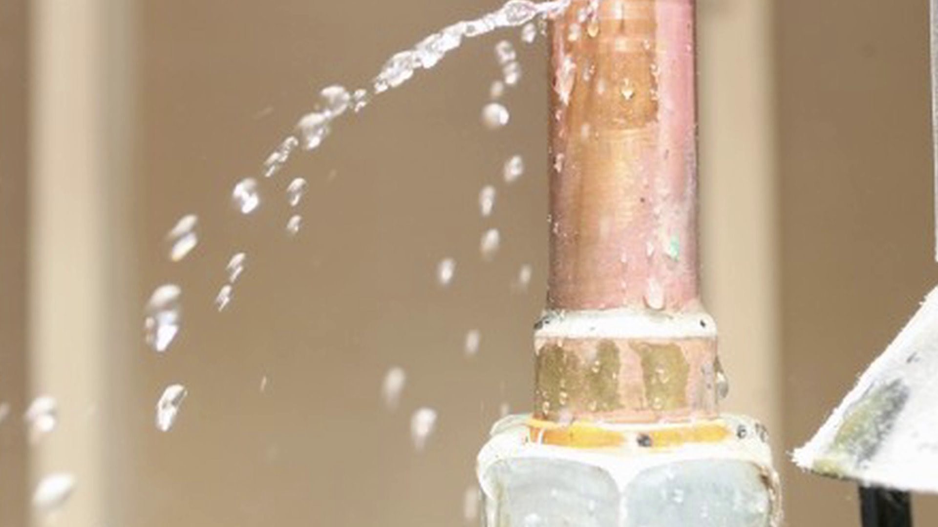 A water pipe is being drained from a faucet due to frozen pipes.