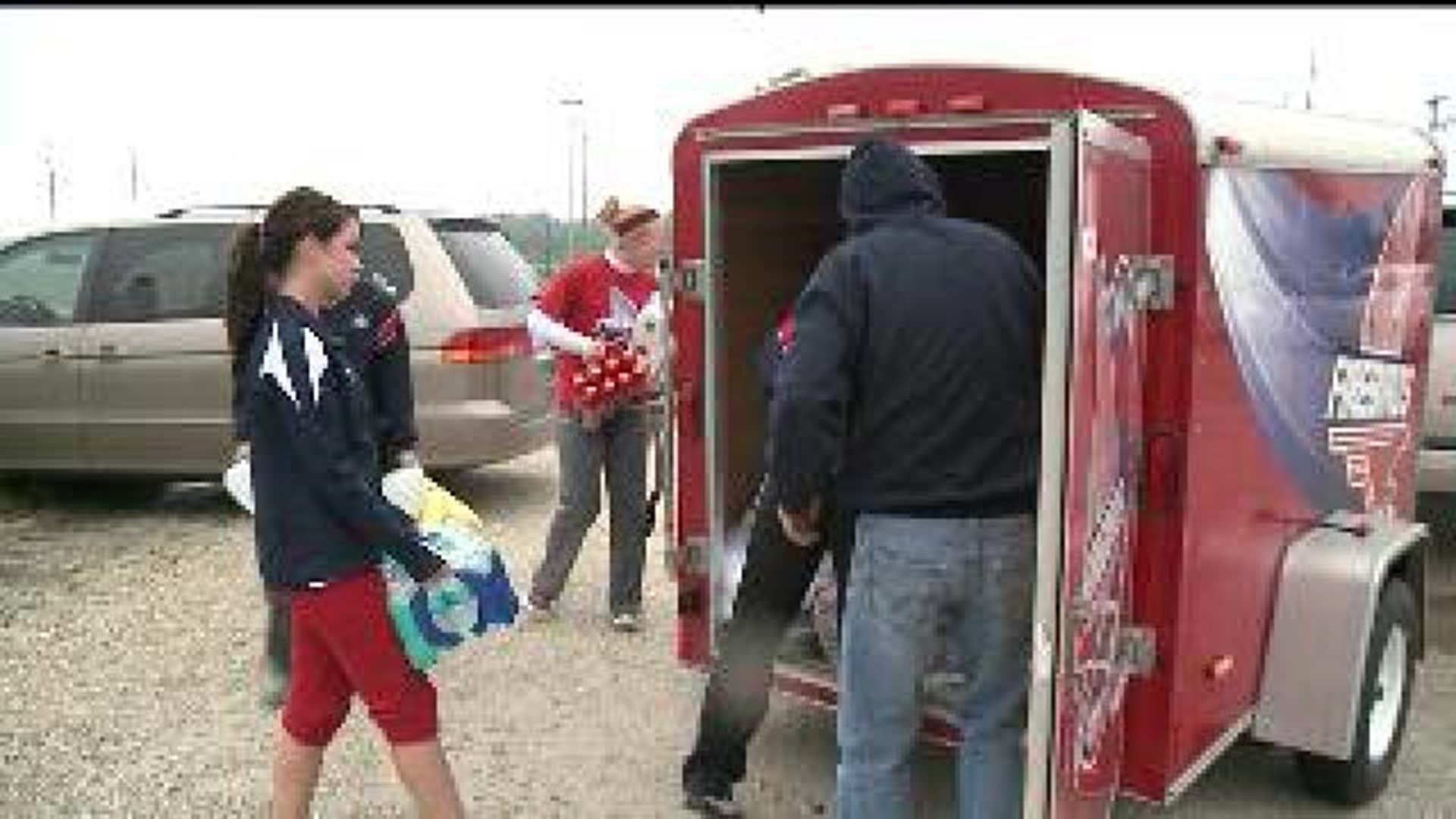 Local softball team takes donations to Oklahoma as they go to play ball