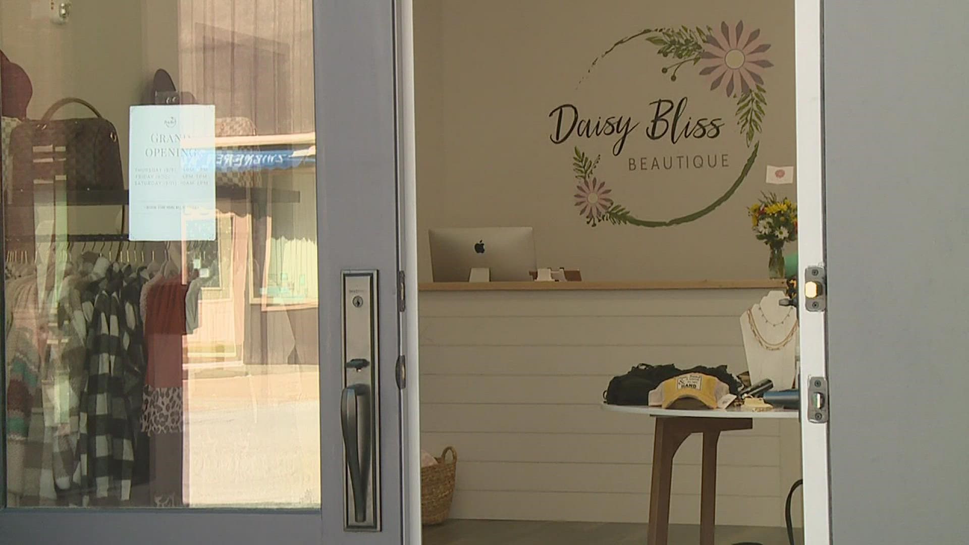 After 3 years of online-only sales, Daisy Bliss opened in downtown Aledo, where empty windows and 'For Sale' signs dot all too many storefronts.