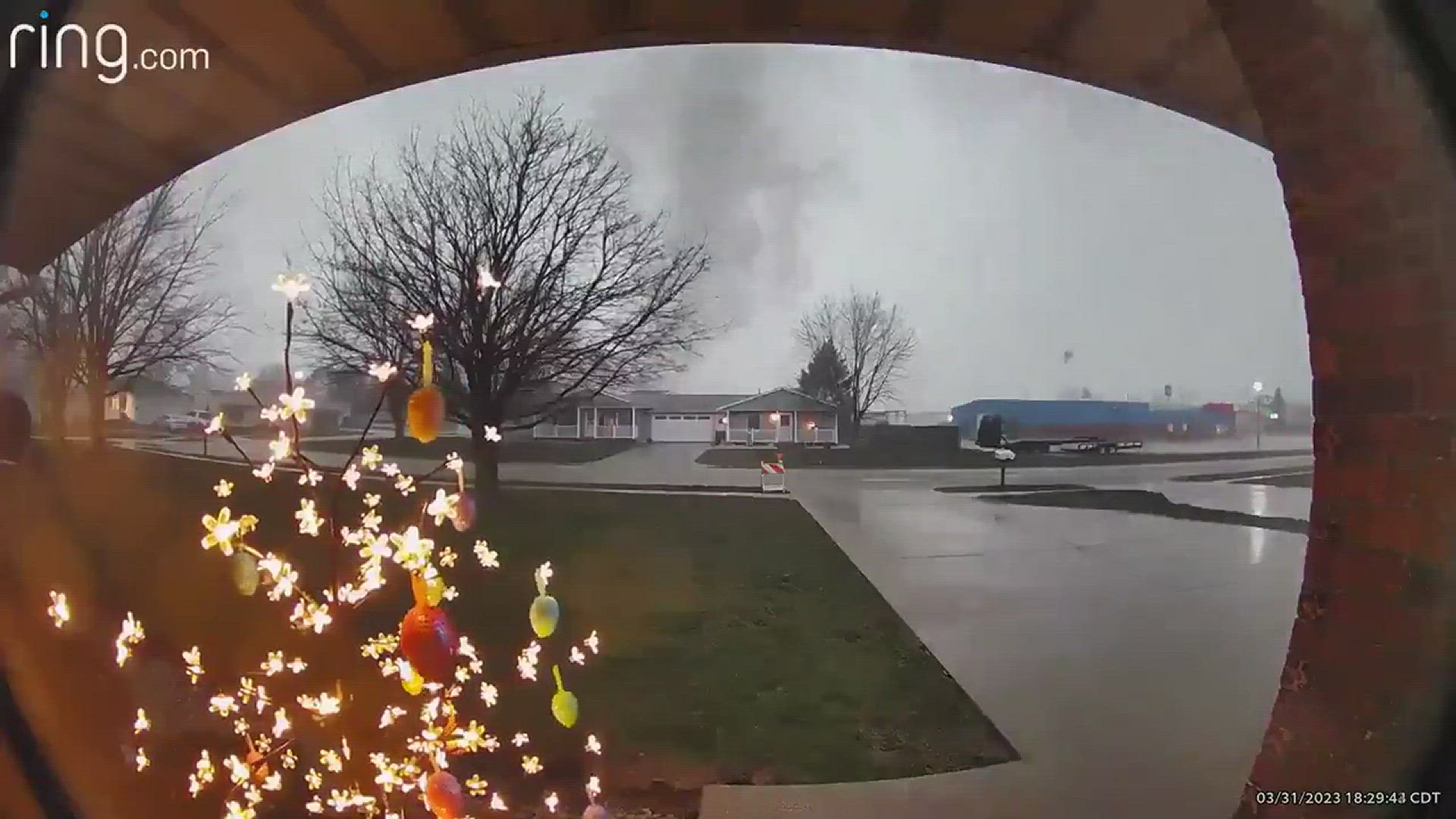 A video doorbell camera captures a tornado that touched down in Geneseo Friday night, sending debris flying into front yards.