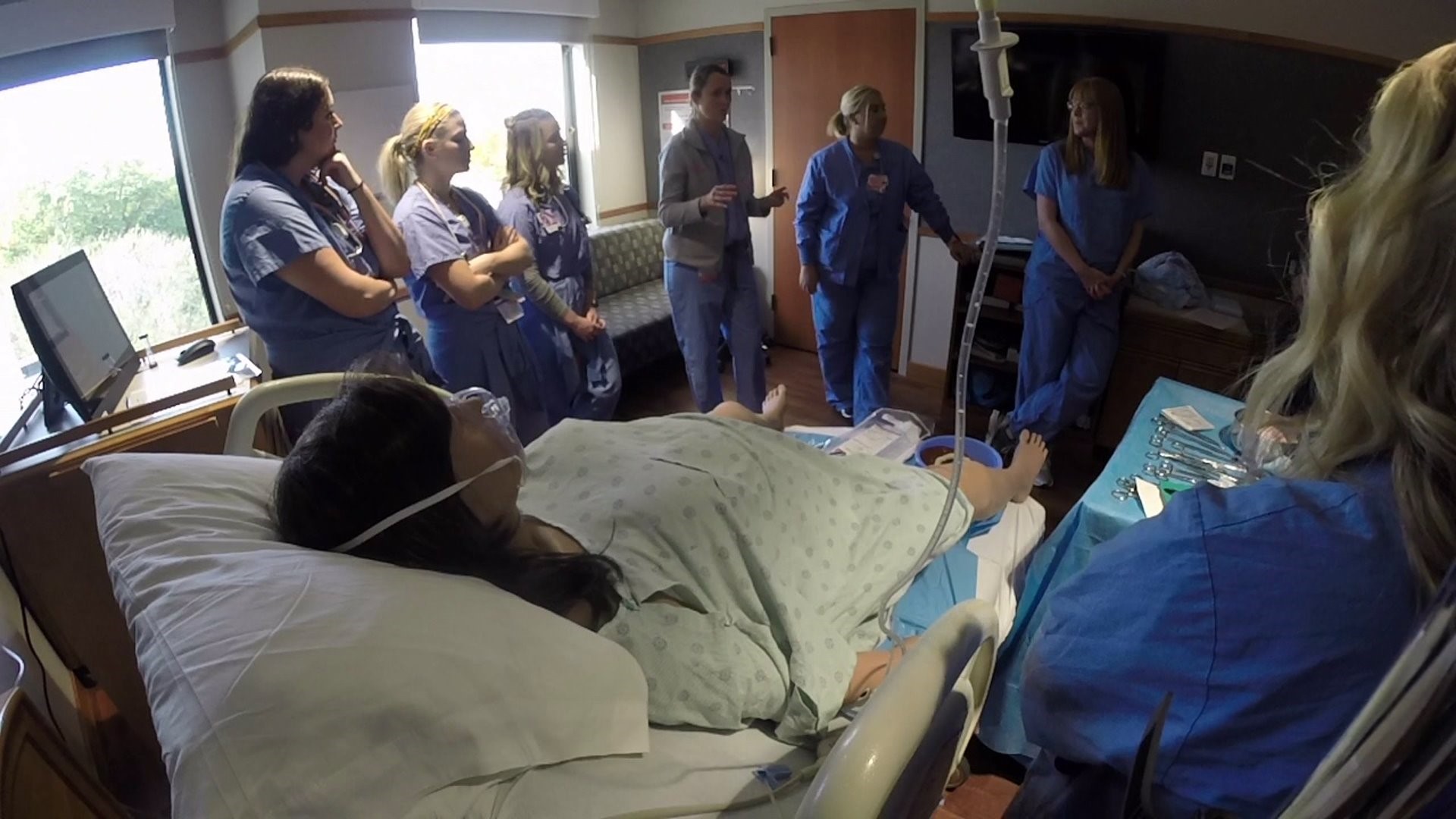 Nurses practice birth complications on simulator at Genesis