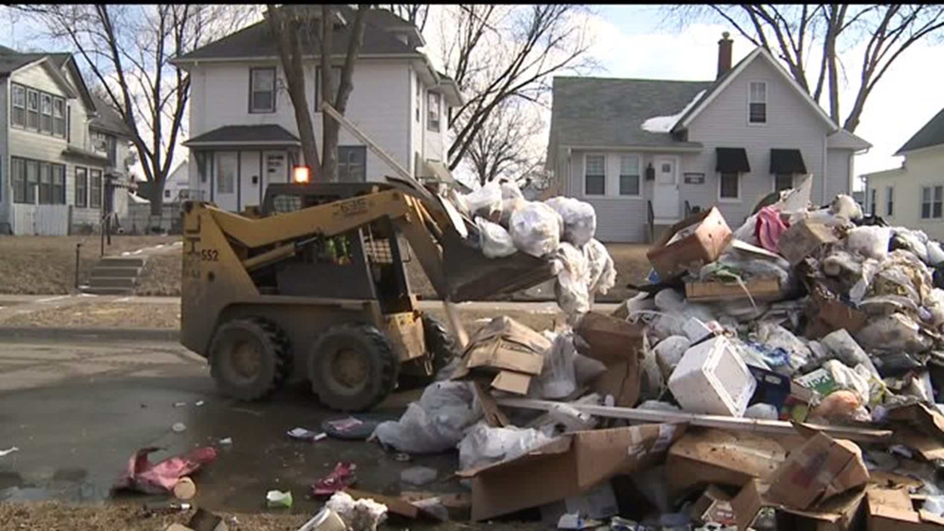 Fire forces trash carrier to dump load in street