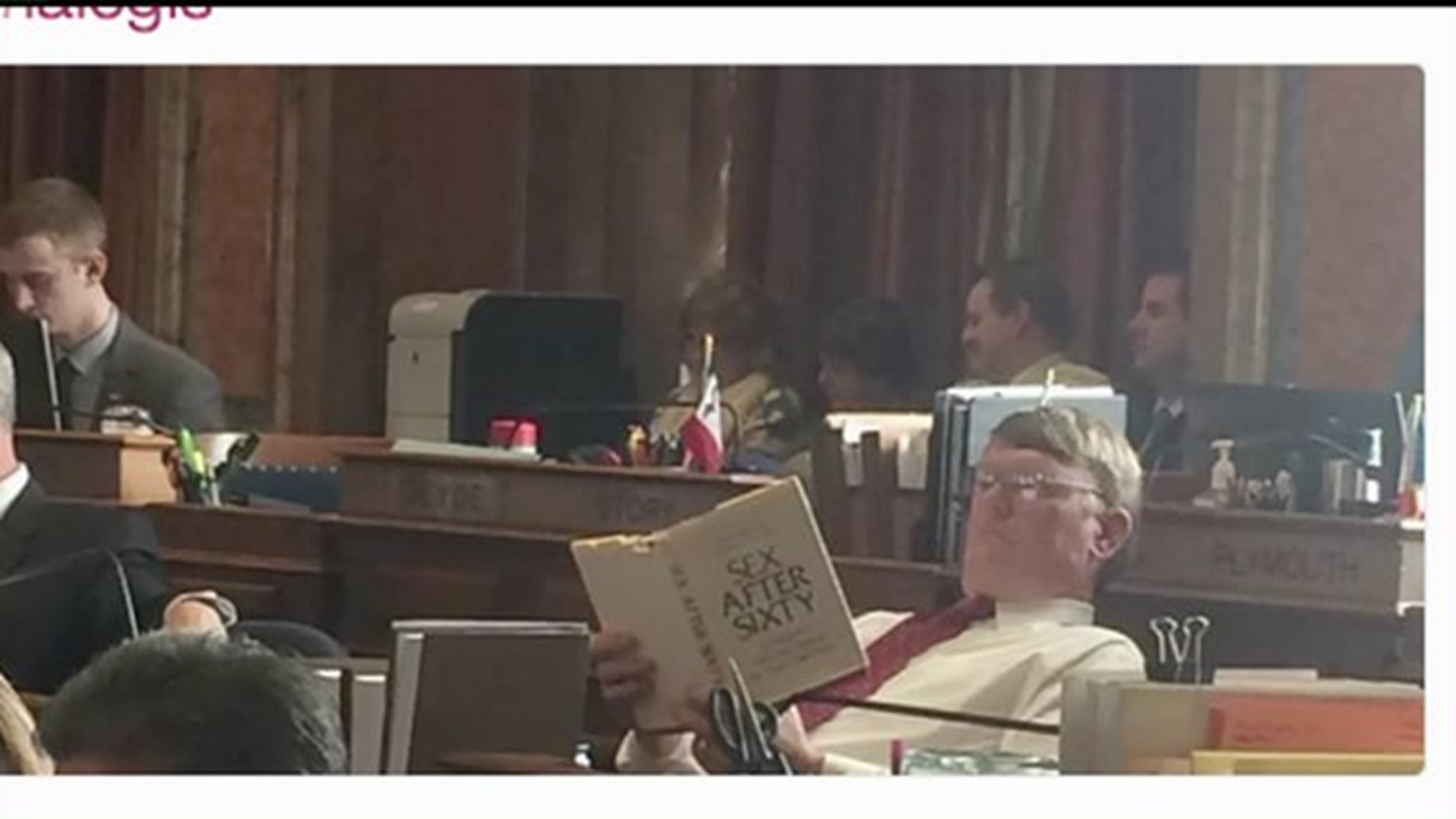 Lawmaker spotted reading tells what really happened
