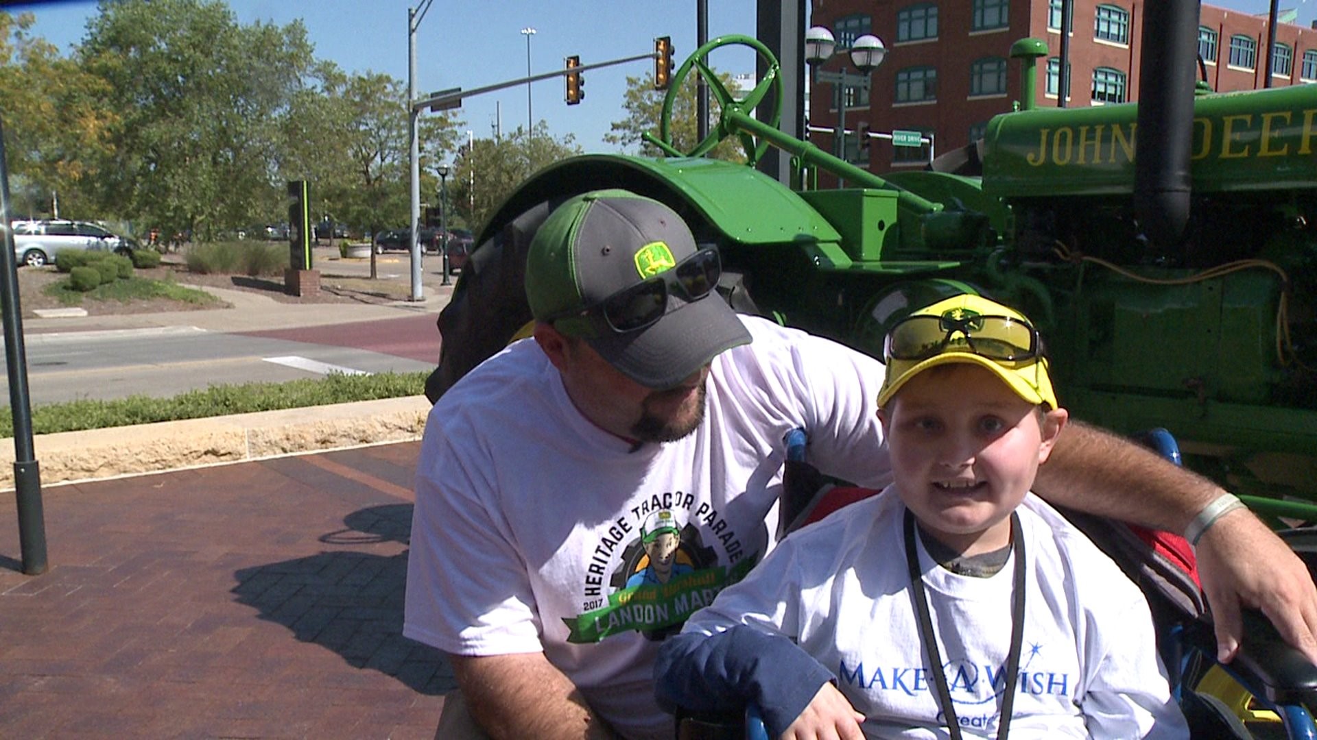 Make a wish child leads tractor parade