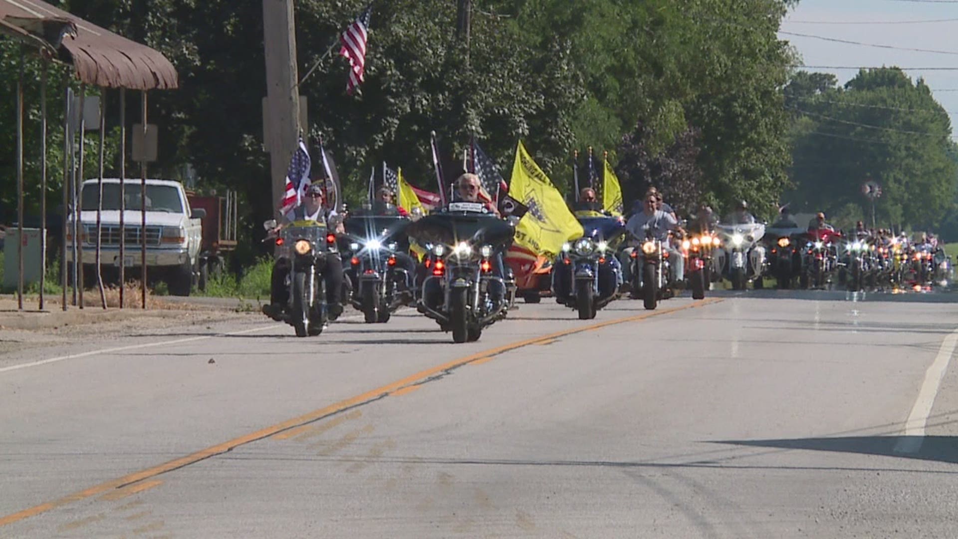 Nearly 100 bikers rode through Little York to pay tribute to Larry "The Flagman" Eckhardt with one final ride.
