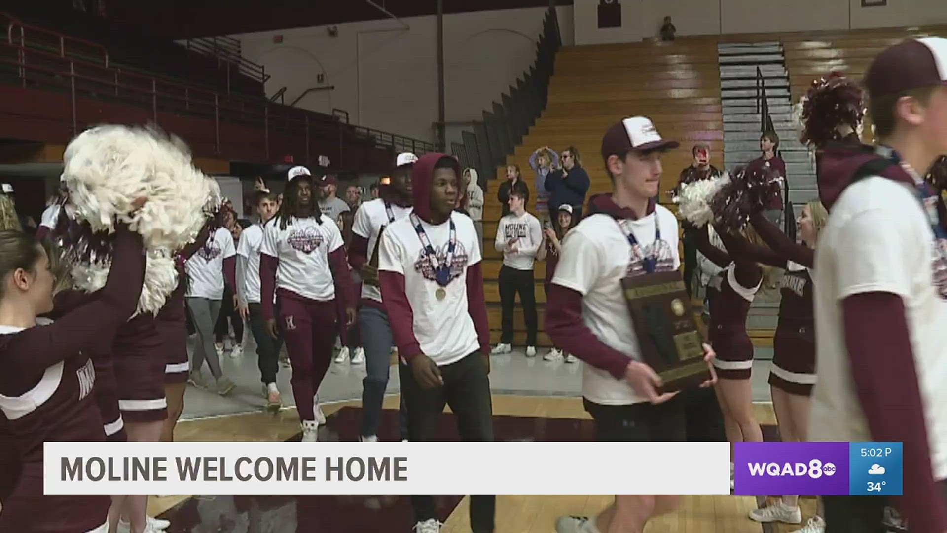 Moline residents line Avenue of the Cities to welcome home the Class 4A State Champs.