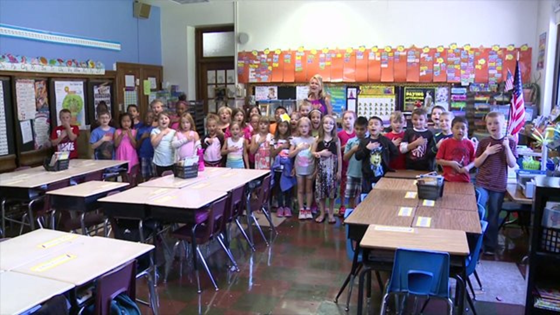 Mrs. Fisher`s class says the Pledge of Allegiance