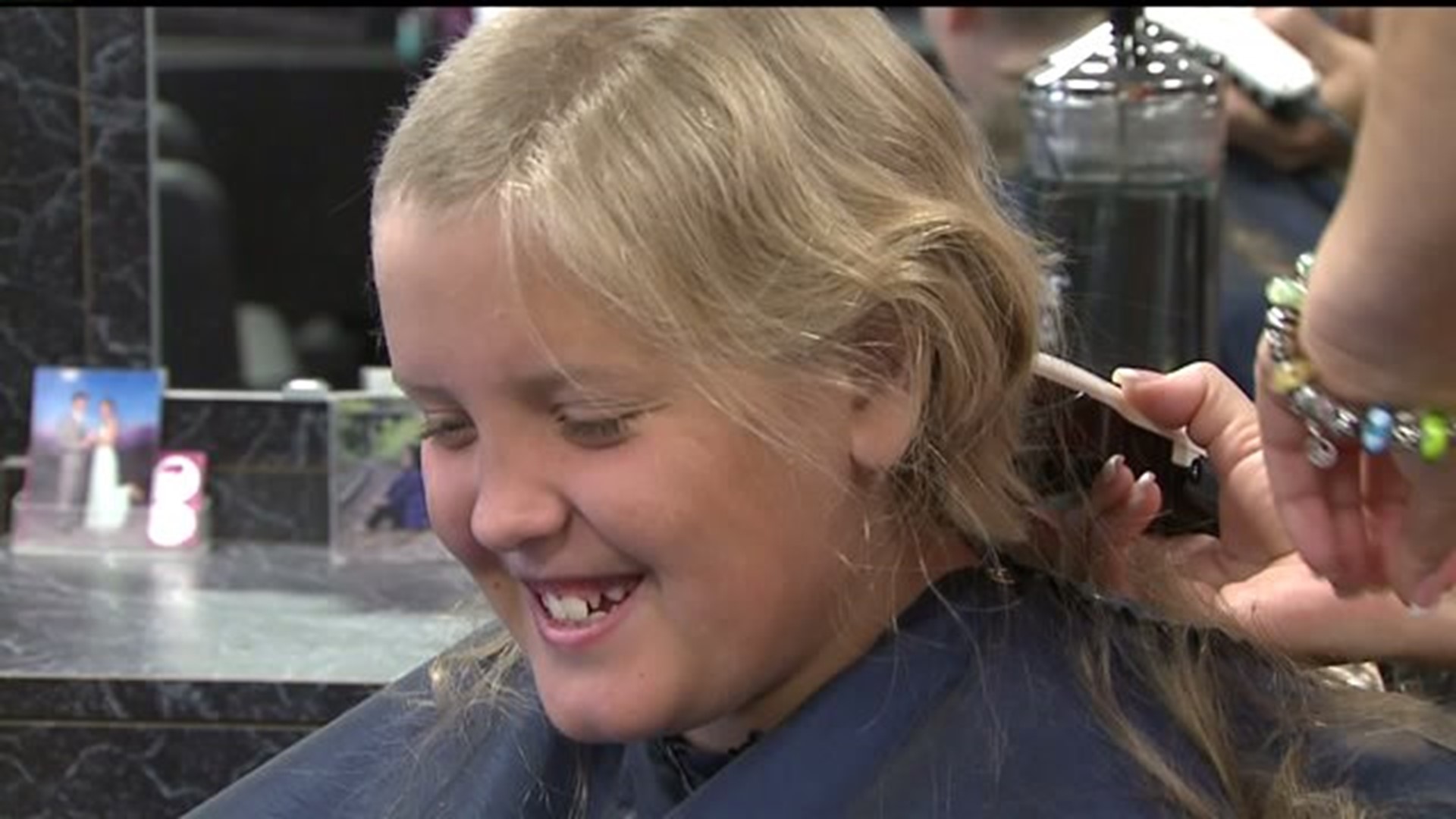 Bettendorf boy grows hair for charity in honor of late sister