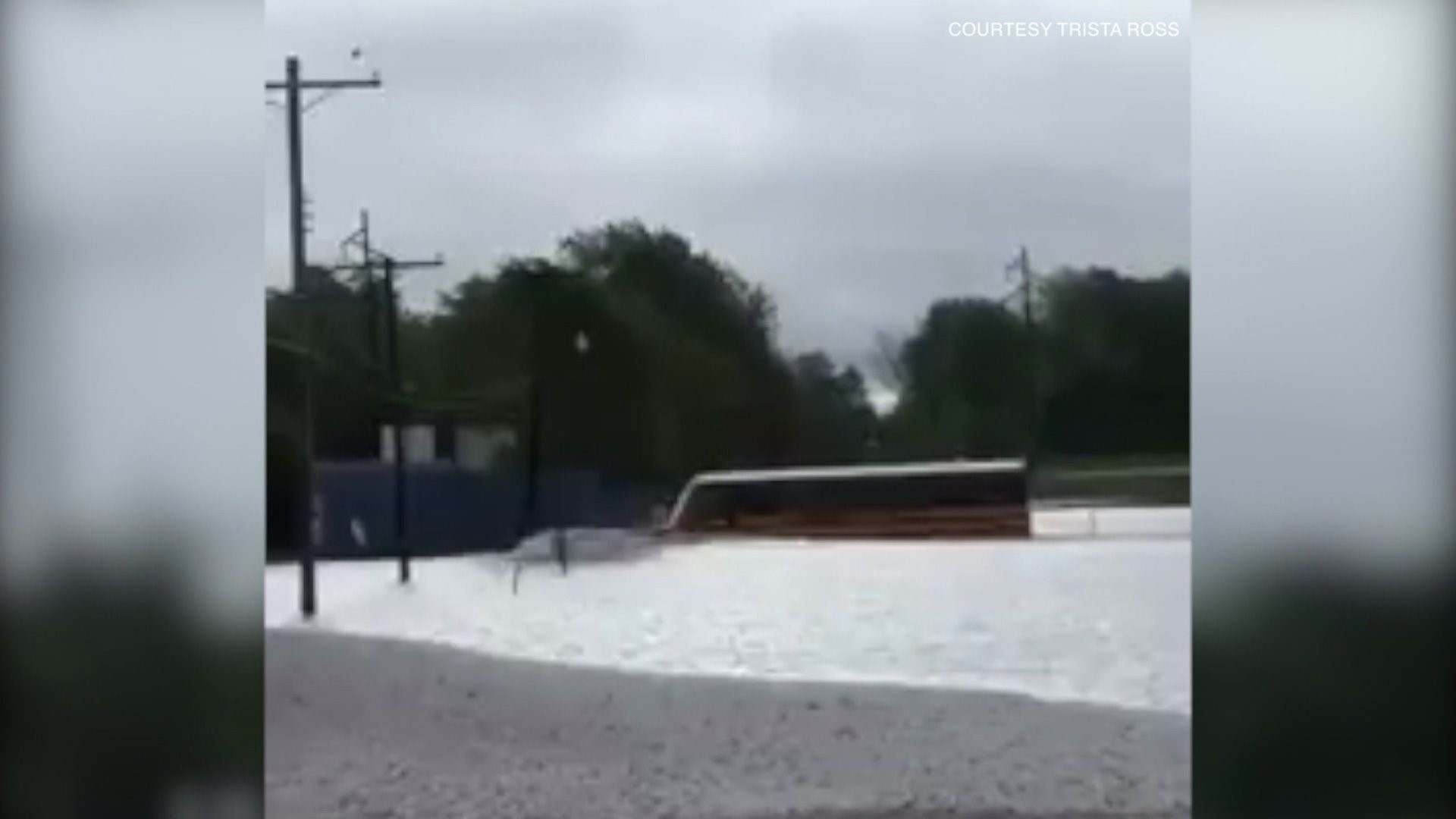 Bus plows through floodwaters