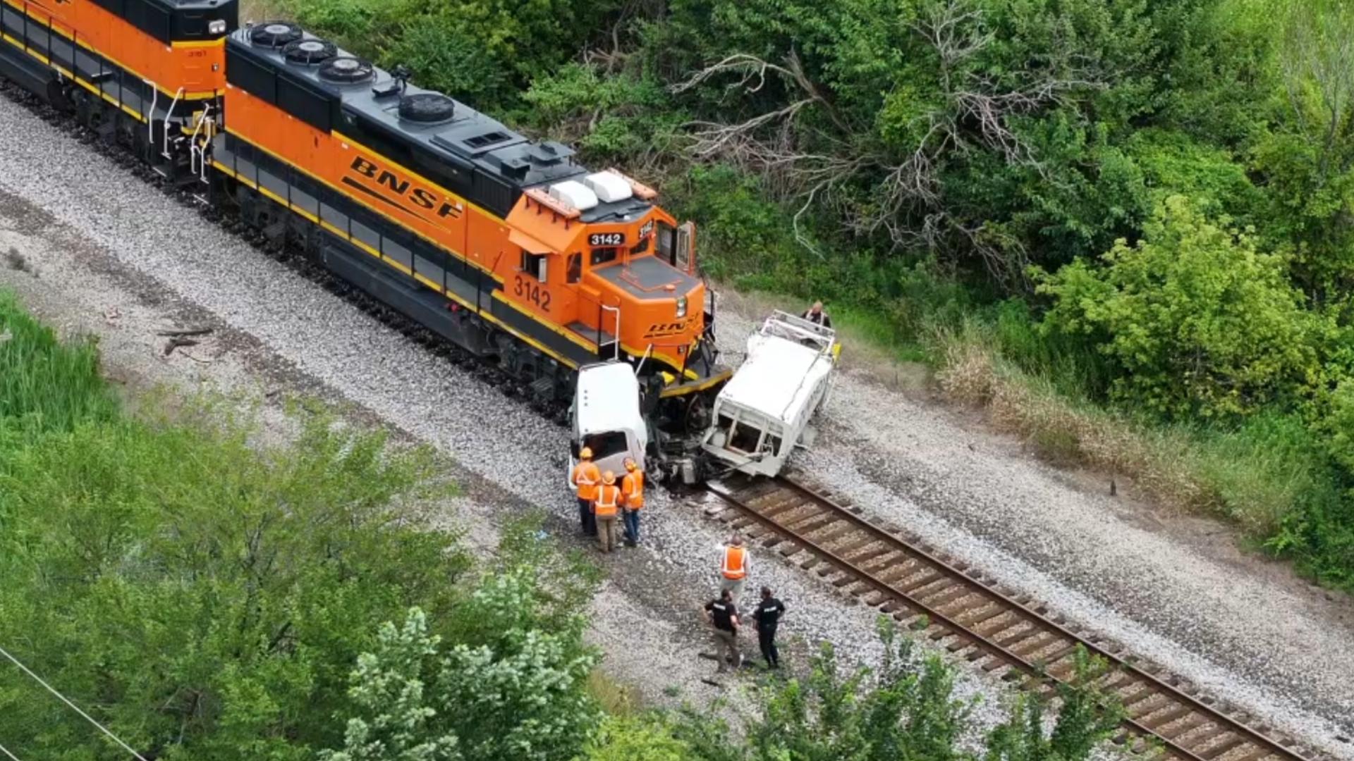 Authorities say they're investigating a collision between a freight train and a dump truck that took place on Thursday, Aug. 1.