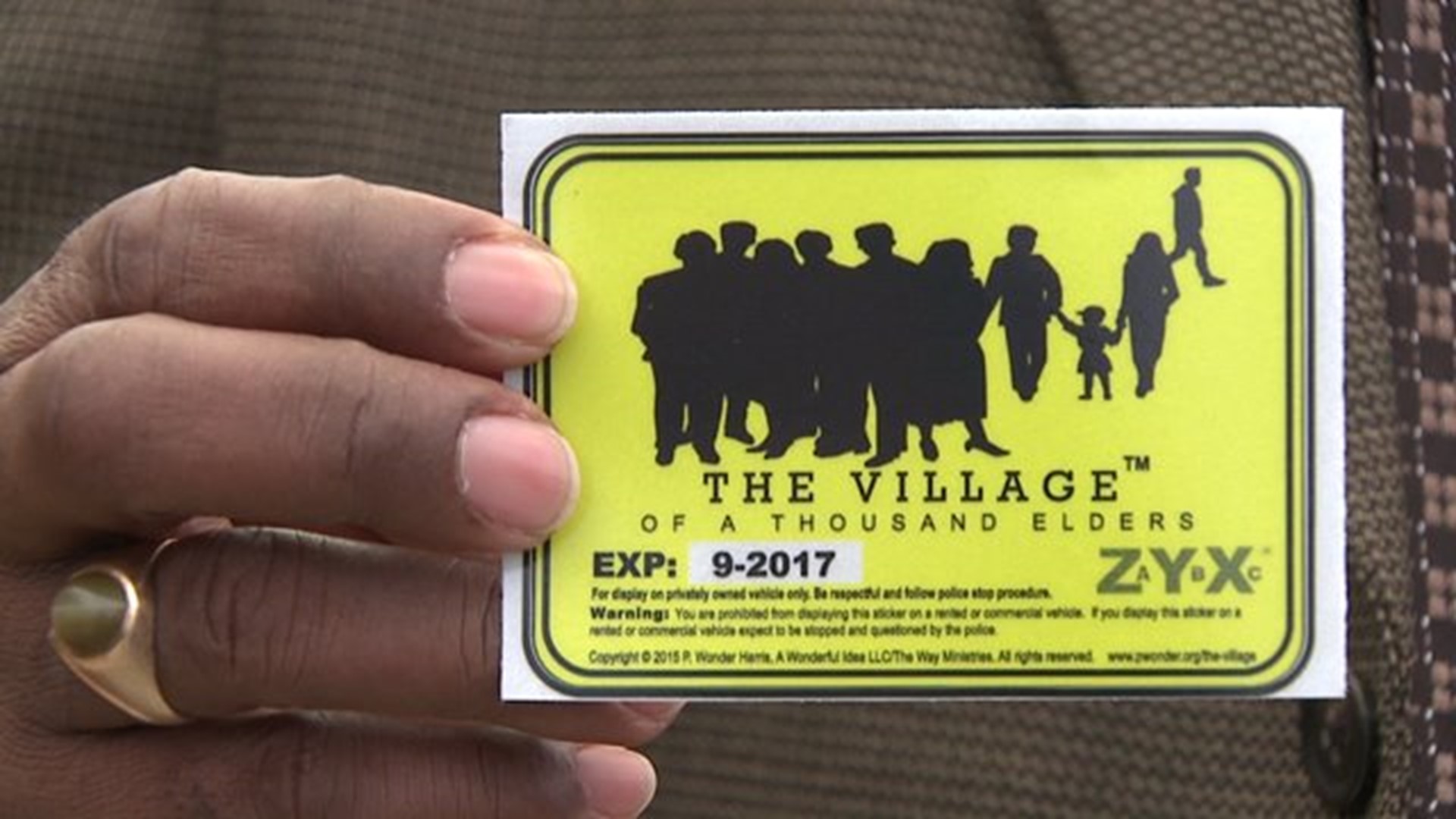 Community organization hopes stickers ease police tensions