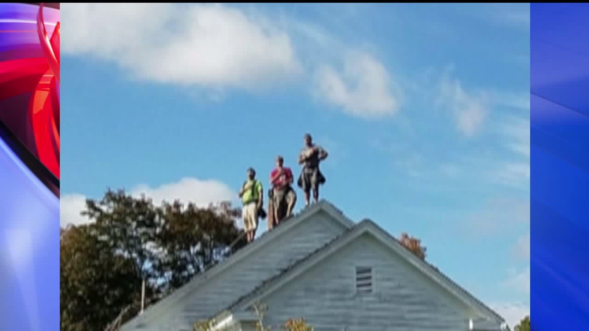 Roofers stand for National Anthem